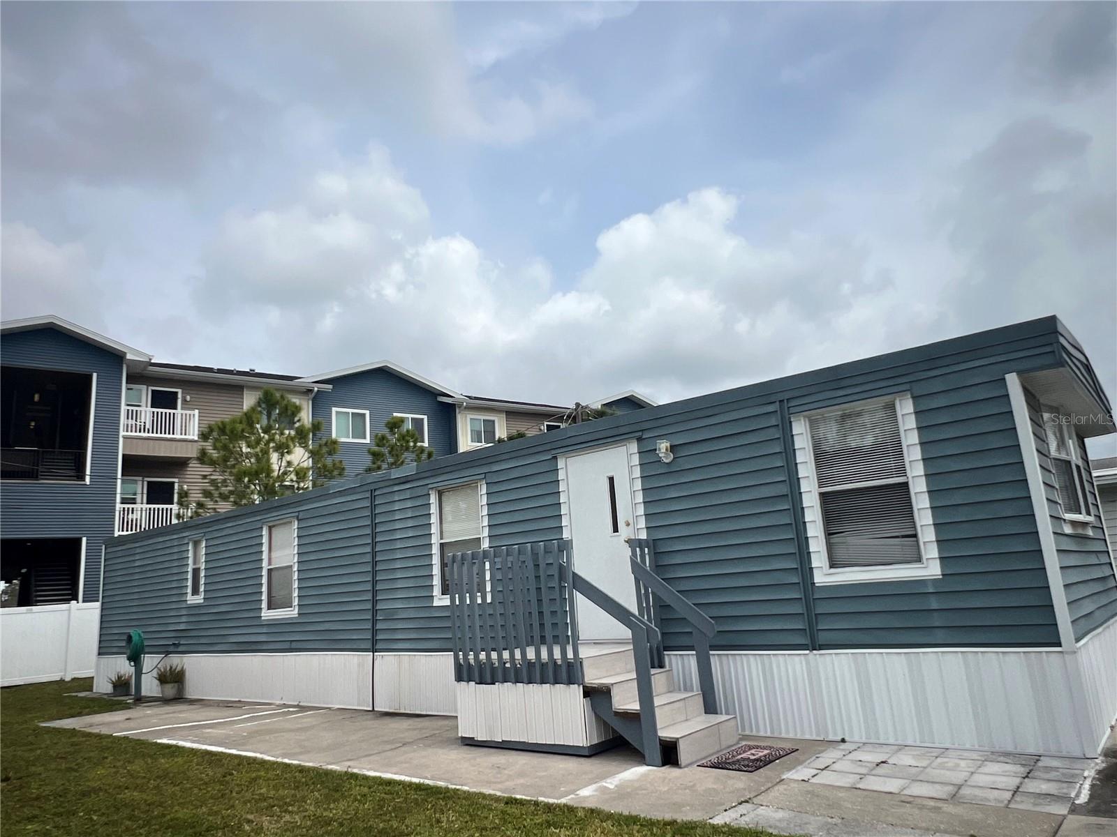 Looking for a 55 plus Co-op community? You will own a share in Parkridge Mobile Manor which is included in the affordable monthly maintenance fee of $207 (including water trash and grass).This 2 bedroom 1 bath home includes a washer and dryer so you don't need to carry your laundry to the facility in the park. An oversized parking pad can easily fit two vehicles. Is very close to the stores also the beach. NO damage from the hurricanes. This is a great mid-county location! Enjoy Florida year round or choose to use this as a winter get-away. Schedule your Showing TODAY !