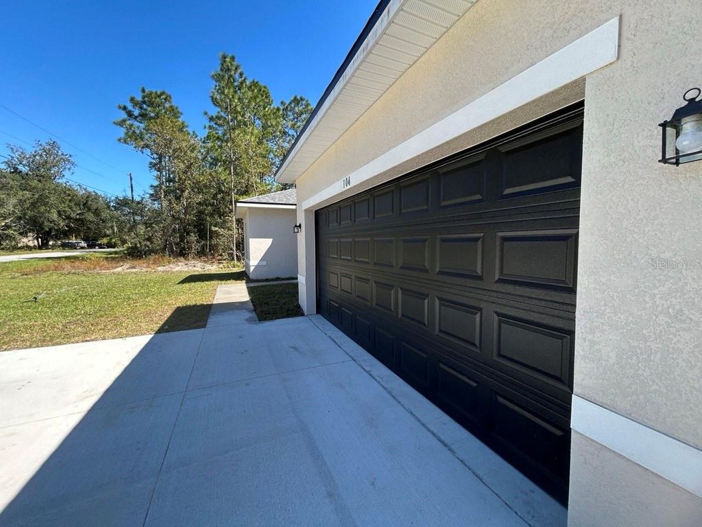 Photo of 104 W Greenbriar Pl, Citrus Springs, FL 34434 (MLS # O6331013)