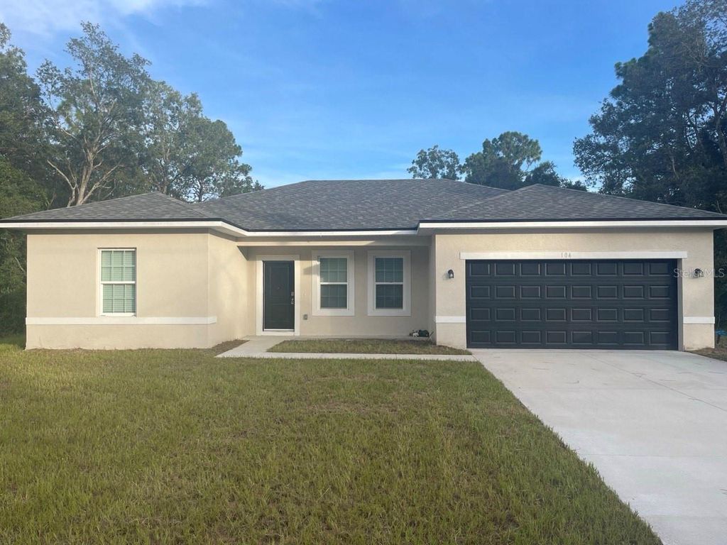 Photo of 104 W Greenbriar Pl, Citrus Springs, FL 34434 (MLS # O6331013)