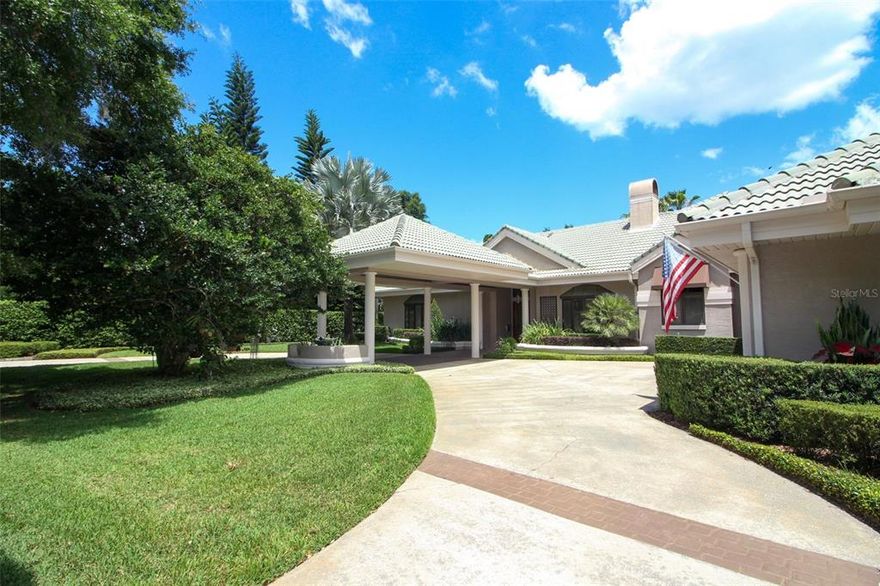 Located in the heart of the Vias, this elegant and meticulously maintained home exudes warmth and endless quality and style throughout. It’s bright, neutral décor and contemporary style, along with its 12’-17’ detailed ceilings, make this exceptional and rare one-story home stand out. Features include a fully integrated surround sound inside and out, two remote controlled gas fireplaces, custom solid maple cabinetry, maple hardwood floors, Pella thermal pane windows, custom built-ins, tile roof, circular drive, 3-car garage, porte-cochere and the list goes on and on.  The fully retractable sliding doors open to the air-conditioned screened outdoor living area, complete with summer kitchen, blending the inside area with the outside, making it ideal for entertaining. The patio retractable screens leading to the pool and spa area expand it even further. The chef’s kitchen has granite countertops, 30” double Thermador convection ovens, 48” built-in Sub-Zero refrigerator, Bosch dishwasher, Viking wine refrigerator and Dacor 6 burner gas cook top.  The fabulous master suite is separated from the secondary bedrooms and has its own fireplace, his and her custom designed walk-in closets (his with a cable hook up for a tv – hers with a island and beautiful chandelier), unique glass top dual vanities and marble flooring.  The laundry room includes a Leibherr 36” refrigerator, washer and dryer, sink and pantry. All situated on a generous double lot (120 X 165) with towering oaks, lush landscaping and private backyard. Conveniently located on an “Olde” Winter Park brick street, this home is a must see. Furniture negotiable. Room Feature: Linen Closet In Bath (Primary Bathroom).