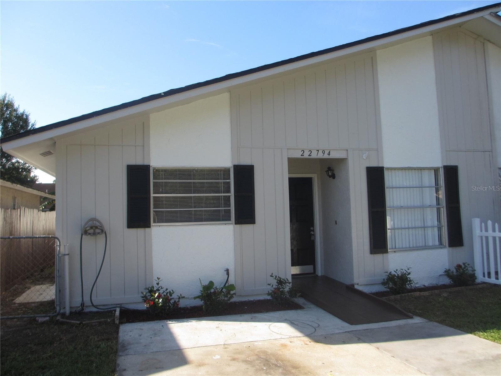 One or more photo(s) has been virtually staged. UPDATED Ready for Move In - 3 Bedroom 2 Bath villa! Almost 1,100 square feet! Kitchen has been updated with newer cabinets, newer countertops and more! Bathrooms have been updated with newer vanities and designer framed mirrors. Vinyl floors throughout - no carpet! Central heat & air and washer and dryer hookups. Please drive by first - there is no sign at the property, but we want you to see that it is a villa - connected to another unit. Very nice and like a home as you have your own driveway and PRIVATE fenced yard, but it is connected. After you drive by, call your Realtor to schedule a showing. If you respond via email, you MUST include a phone number to receive a response. This ad will be removed when the property is rented. 22794 Penny Loop, Land O'Lakes, FL 34639 State Road 54, North on Collier Parkway, Left on Weeks, Right on Martha which turns into Penny Loop. Pets allowed, but breed restrictions.