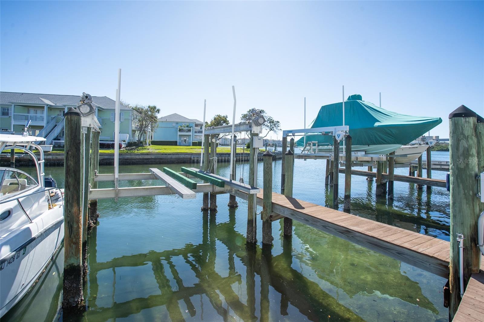 Looking for a boater’s paradise? Welcome to Waterside South at Coquina Key! This slip is three slips from Little Bayou which opens up to Tampa Bay and is one of the few that have been dredged by the U.S. Army Corp of Engineers! It is suited for larger boats of 30 feet in length with a 13,000-pound lift. With the automatic lift, equipped with water and electricity and secure dock box for extra storage, you’ve got all you need to start living that Florida lifestyle you’ve been dreaming about. Enjoy easy access to get to downtown St. Pete, or cruise over to St. Pete Beach to watch the sunset. Or spend the day at Waterside South to get full access to the Yacht Club, Olympic-sized swimming pool and spa, waterfront dock, multiple sports courts and so more, all behind a secured 24/7 guard gate. All maintenance is handled by the HOA. Please note: You must own a unit in either Waterside South or North to purchase a slip.