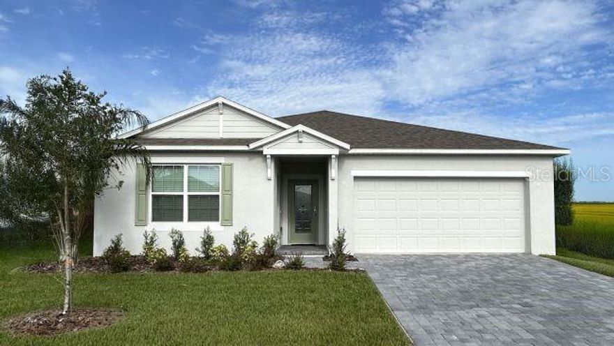 Pre-Construction. To be built. Modern design and thoughtful upgrades come together beautifully in The Sheffield, located within the brand new Woodland Ranch community, and featuring a private mulit-generation suite that adds exceptional flexibility and functionality. Complete with its own private entrance, convenient kitchenette, and private en suite bath, this well designed living space enhances the home’s layout while providing comfort and independence. Two additional secondary bedrooms further complement the floor plan with well appointed spaces that can be adapted to a variety of needs. The stunning kitchen serves as a striking focal point, showcasing quartz countertops, a spacious island ideal for preparation and casual dining, a large pantry, stainless steel appliances, all adding refined finishing touch. Both stylish and practical, this space connects seamlessly to the main living areas. The great room opens effortlessly from the kitchen, creating a bright and inviting atmosphere enhanced by triple panel floor to ceiling patio doors. These doors lead to an extended covered lanai, expanding the living space outdoors and creating a seamless indoor outdoor connection that enhances everyday living. Privately positioned at the rear of the home, the primary suite provides a peaceful retreat with a spacious layout designed for comfort. The en suite bath features a floor to ceiling tiled walk-in shower with enclosure, quartz countertops, and refined finishes that create a relaxing spa like environment, while the large walk-in closet provides generous storage. Convenience continues with a centrally located laundry room that includes a utility sink, washer and dryer. Architectural shingles, professional landscaping, and irrigation system enhance the exterior and help maintain a beautiful setting year round. Modern smart home features include a Ring Video Doorbell, Smart Thermostat, Keyless Entry Smart Door Lock, and Deako Switches, bringing advanced convenience, efficiency, and peace of mind. A full builder warranty adds lasting confidence. Woodland Ranch enhances daily living with resort style amenities including a swimming pool w/cabana, play lawn for recreation, sidewalks, and a pet friendly environment. The community is located just 1.8 miles from East Central Park and only 5 minutes from US 27 in Dundee, placing shopping, dining, and recreation within close reach while maintaining a peaceful residential setting. Experience the exceptional design, elevated finishes, and versatility that make The Sheffield a standout residence boasting a stone exterior accent has space for all! Take the next step toward making this remarkable home your own.