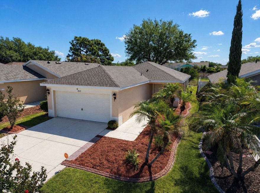 One or more photo(s) has been virtually staged. This beautifully upgraded home has everything you could want! From the open floor plan, beautiful view with no backyard neighbors, and abundance of natural light, this 3 bedroom home offers it all. Not only is the home ready for your finishing touches, but it also comes with bi-weekly yard service paid through September, a paid-for Vivint Home Security System, and a not-yet year-old roof—giving you a low-maintenence start in your new home. The great view is seen through the big sliding doors the moment you walk through the front door, instantly drawing your eye out to the backyard. The main living space feels open and bright, making it perfect for both everyday living and having people over. Your private oasis of a primary bedroom also provides that amazing view, with plenty of natural light and a calm, tucked-away feel. You can even step outside and enjoy it from under the covered porch—whether it’s morning coffee or winding down in the evening. The secondary bedrooms up front offer more seclusion, while sharing a bathroom, making it a great setup for guests, family, or even a home office. Out back, the covered porch gives you a comfortable outdoor space to relax, and with no rear neighbors, you’ll enjoy a level of privacy that’s hard to come by.  What really sets this home apart is the lifestyle. Rivercrest residents enjoy resort-style amenities including multiple pools, a hot tub, a children's splash park, playgrounds, and tennis and basketball courts. A scenic walking trail of approximately a half mile winds around the community pond, complete with outdoor fitness stations, making it easy to enjoy a walk, a jog, or simply take in the peaceful surroundings. Located in a convenient Riverview location close to shopping, dining, and major roadways, this home combines comfort, updates, and a great setting all in one.