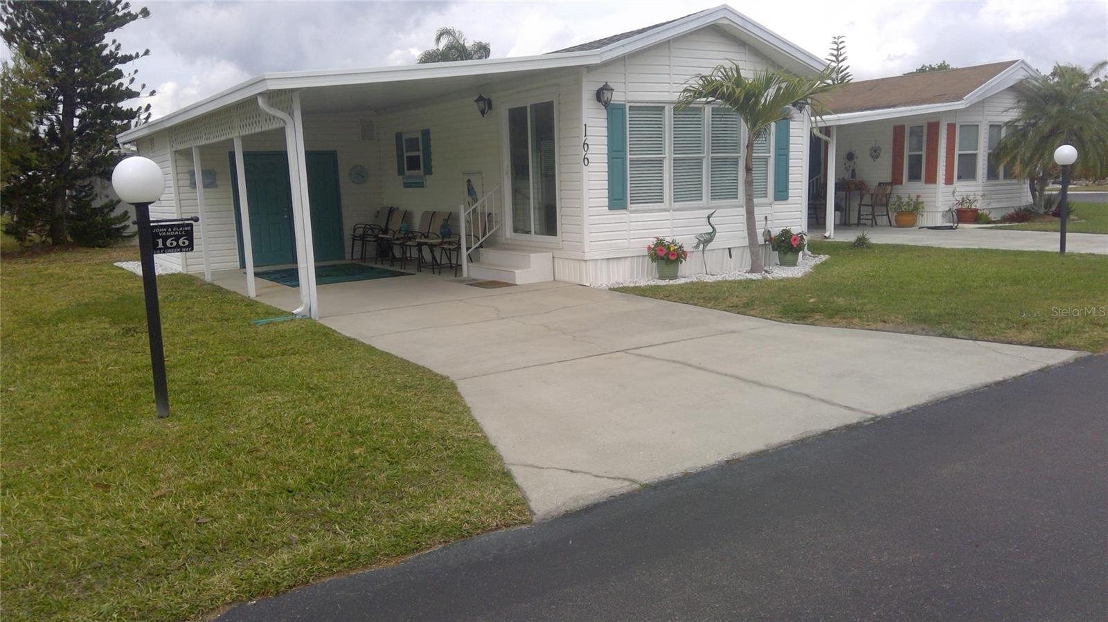 This adorable park model is conveniently located at the front of the park, just steps from all the parks amenities such as the clubhouse, pro shop & golf course, pool/hot tub, tennis/pickle ball court, shuffleboard, corn hole court, two doggie parks, library, billiards room & laundry room. This house was completely renovated a few years ago, including Brazilian marble counters in the kitchen & bathroom, painted through- out including all the cabinetry, updated with new knobs & hinges, ceiling fans, all new electrical plates & light fixtures, new furniture, luxury vinyl flooring w new carpet in the bedroom giving this home a new, fresh appearance. The roof was replaced in 2017, replaced the sliding glass door & the A/C is approximately 10 years old w a new fan motor. A murphy bed is installed in the golf cart shed and the couch converts into a sleeper to accommodate guests. This gem is incredibly neat & clean and offers an unbelievable amount of storage.
This home is located in central Florida in the 55+ community of Lily Lake Golf & RV Resort. The park is exceptionally neat, clean and well maintained, definitely shows pride of ownership. The current association fee is $206 per month, collected twice a year. Included in that fee is your lawn mowed & trimmed, basic cable, internet and the removal of garbage. The community is very active & friendly so grab your sunglasses and come on down where you shovel sunshine & join the fun! The golf course operates as a separate business, so additional fees apply.