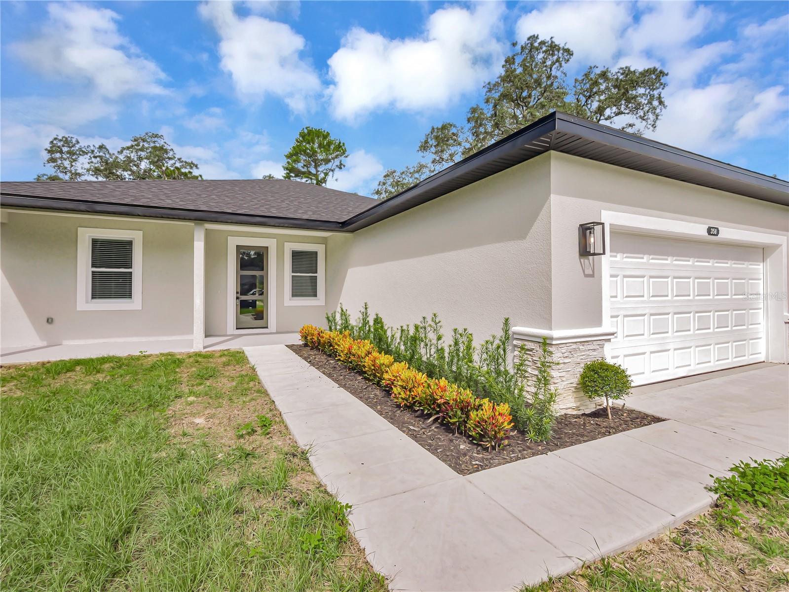Beautiful New Construction Home with NO HOA! This home has all the features and upgrades you are looking for including Block Construction, Quartz Countertops, Luxury Vinyl Flooring, Lighting, Laundry Room & Amazing Shower and Tub in the Master Suite. You will enjoy the split plan and open layout which is perfect for having guests over to visit. This is affordable New Construction in the growing area of Ocala, where you can enjoy camping, hiking, and fishing in nearby parks and springs. *All information is intended to be accurate but is not guaranteed.