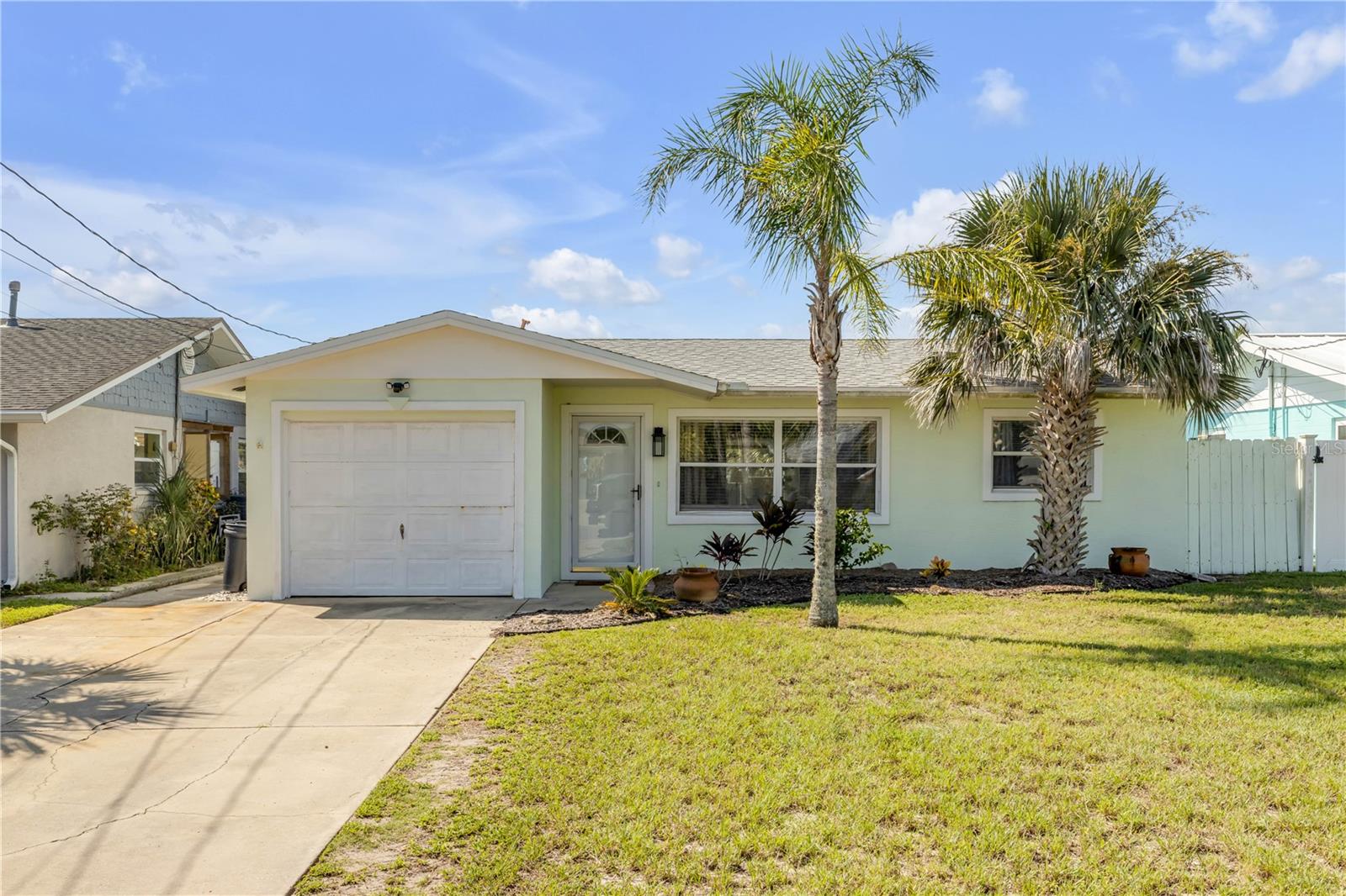 **Beachside Bliss – 2BR/2BA Home Just Blocks from New Smyrna Beach!**
Discover the charm of coastal living in this beautifully updated 2-bedroom, 2-bath beachside retreat. Located just a short stroll from the shoreline, this home blends modern upgrades with classic Florida flair. The newly renovated kitchen features sleek appliances and generous storage, while recent improvements like a new roof and water heater offer lasting peace of mind.
Inside, you’ll find renovated bathrooms with a fresh beach-inspired design—adding style and a relaxing, spa-like feel to your daily routine. The inviting Florida room is perfect for unwinding after a day in the sun, and the oversized backyard is a rare find—ideal for a resort-style pool or creating your own private outdoor oasis.
All of this, just blocks from the beach and close to local dining, shopping, and entertainment.
**Don’t miss your chance to own this beachside beauty—schedule your private tour today!**