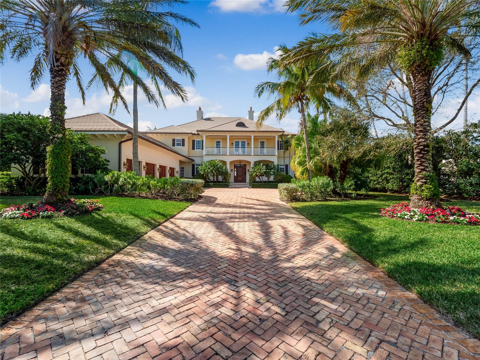 Expansive, southerly intracoastal views in this one-of-a-kind Estate Home. This custom home boasts 6 bedrooms, 8.5 bathrooms, elevator, media room, recreation room and two primary suites . Unparalleled custom millwork adorns every room including crown molding, base molding, cabinetry and coffered ceilings. The exterior features 110sq ft of waterfront with boat lift and over 2500sq ft of covered outdoor living space. An impressive pool and spa, with large patio and outdoor kitchen, create a resort-like environment. You will not find another home like this in Vero Beach, with lush manicured gardens, incredible sunsets and a sun-drenched interior. This is truly an exquisite living experience.