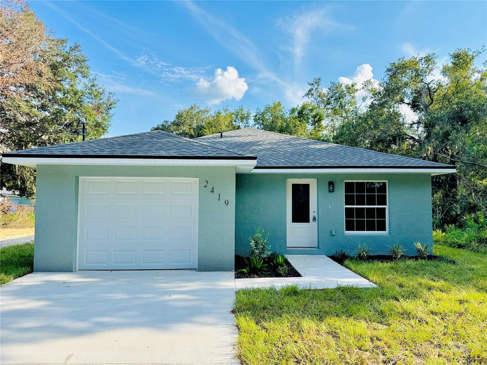 This newly built 3-bedroom, 2-bath home offers an efficient, open floorplan with 1,322 square feet of low-maintenance living. Inside, you'll find durable LVP flooring throughout, a clean, modern kitchen with quartz countertops, Boutique Zellige backsplash, custom cabinets with upgrades such as soft closing doors, a revolving corner shelf, spice rack, and pull out garbage cabinet. Also a garbage disposal, and a full set of stainless steel Samsung kitchen appliances- including a smart stove! The primary suite includes a walk-in closet, and the backyard backs up to a wooded area, offering some privacy and natural views. No HOA!
Most importantly- enjoy peace of mind with an optional 2/10 Builders Warranty. This covers workmanship, distribution systems, and a structural warranty!
Located close to shopping, restaurants, an Urgent Care facility, and seconds away from the Polk Parkway!