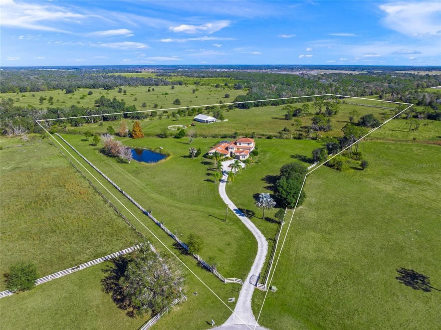 Don't miss this rare opportunity to own your one-of-a-kind 15+ acre estate in the exclusive Sarasota Ranch Club Community.  This Custom Maglich Builders Mediterranean-Style home with a detached two-stall (plus tack room) 1980 Sqft horse barn sits on 15+ fully-fenced acres.  The possibilities are endless for this rare find.  Travel down the winding gated driveway and circular parking pad and enter the home through a grand entry, showcasing beautiful bamboo floors, views of the office, living room, dining room and the saltwater pool and backyard retreat.  The gourmet kitchen offers granite countertops, built-in appliances and a second sink, perfect for a prep-station or versatile entertaining.  The primary bedroom is separated from the other 3 ground-floor bedrooms, providing plenty of space for a large family, houseful of guests, or just comfortable every-day living.  The large 5th bedroom is currently setup as an upstairs bonus room.  An attached two-car garage and a detached one-car garage (connected by porte-cochere) create a private courtyard, shielded from the street.  The backyard oasis features an outdoor kitchen, screen-enclosed saltwater pool, and a built-in brick circular firepit.  The detached 1980 Sqft barn has two horse stalls, tack or storage room, and an overhead door.  The space is perfect for horses or could be outfitted as a workshop or entertaining space.  Equine enthusiasts will love the round pen, private horse run-out paddock, and expansive enclosed green pastures.  The private bridle trail is easily accessible with an entrance on the Southeast corner of the property.           

Sarasota Ranch Club is an exclusive private gated equine community consisting of 60 pristine 10+acre tracts, totaling 620 acres.  The Club is nestled amongst century-old majestic oak hammocks, lush pastures, and an abundance of ponds and creeks. With miles of bridle paths and a variety of wildlife, both horse enthusiasts and nature lovers will revel in the serene country setting.

The Ranch Club is only 25 minutes from downtown Sarasota, and is even closer to I-75 , offering a comfortable commute to Tampa and St. Pete. Lakewood Ranch is a 5-minute drive away for your shopping and dining pleasure. The Gulf Coast's beautiful white sandy beaches, challenging golf courses, numerous marinas and cultural events are all within reach.

Don't miss this opportunity!  Schedule your private showing today!