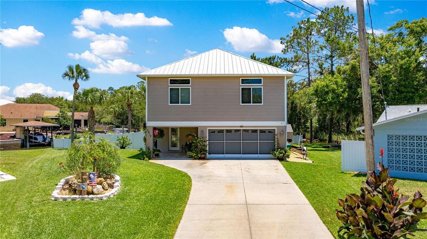 Spectacular 3/2 "stilt elevated" waterfront home with 1728 sq ft of high and dry upper-floor living area. This beautiful house and property is located on a quiet cul de sac with over 150 feet of deep freshwater canal/creek frontage on two sides of the lot. The upper floor features high 9' plus ceilings, large water-front view windows, a spacious living room with fireplace, a dining area and open kitchen, and wood and tile floors throughout the home. This house is "move in ready," and furnishings are optional. Downstairs boasts a fully enclosed extra-large (nearly 800 sq feet) heated and air conditioned garage that may be used for vehicle parking, with enough extra space for 'toy" storage, extra entertainment space, or a workshop. A separate finished and enclosed space is included off the garage. There is a beautiful heated saltwater pool with a large screen-enclosed lanai for entertaining guests or simply for owner enjoyment. The yard and grounds of this home are must-see with beautiful palm trees, a gorgeous lawn, and bloom-filled plants and shrubbery. A newly installed irrigation system assures easy continued lawn and landscape maintenance and beauty. The stone firepit with rock-bedded and landscaped sitting area offers amazing views of the water and the state park wildlife area across the canal. For the river and water lovers, there is direct and easy access to the world-famous Crystal River springs and the Gulf via a short boat ride or kayak paddle. The large fixed dock (12' x 40 ft) is outfitted with 2 boat lifts -- one suitable for a mid-size boat (6000 lbs) and another for jet-skis or other small PWC (3000 lbs) -- and a kayak rack. This home is located adjacent to several state park wildlife areas with ample opportunities for manatee, bird, and wildlife viewing as well as access to world-class near-shore and offshore fishing. Miles of biking and hiking trails are also located nearby on adjacent park lands. This property is also within biking distance to downtown Crystal River with its beautiful historic district, quaint shopping area, and waterfront restaurants and taverns. This is a great "retirement," vacation, or permanent home suitable for outdoor enthusiasts and those seeking all the wonderful amenities that Florida coastal living offers. Located in the highly desirable Indian Woods development, the house is just outside the city limits; therefore, it may be used as a short-term or long-term vacation rental by the owner for his/her guests. The elevated high-and-dry living area offers protection from flooding in the event of a hurricane surge. Current flood insurance is "assumable" and boasts a reasonable and very affordable premium. Schedule your showing of this immaculate and spectacularly beautiful property today!