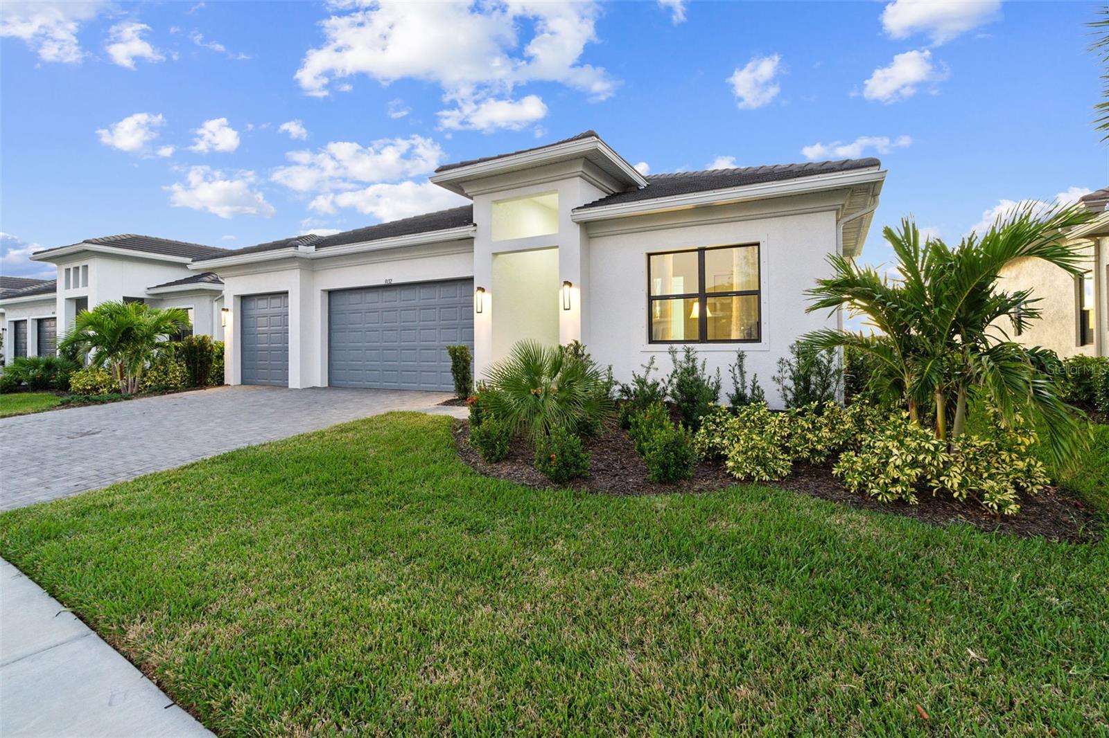 Best Westward Facing Sunset View - Motivated Seller - Hurricane Proven Resistant - Stunning Lakefront Home in Artistry Sarasota*The Dali Model* Welcome to 9132 Bernini Place, a breathtaking lakefront home in the sought-after Artistry Sarasota community. This elegant Dali model, completed 10/2023, offers 2,118 square feet of thoughtfully designed living space, one floor living, within a gross area of 3,041 square feet. The open layout seamlessly blends comfort and style, ideal for modern Florida living. Situated on a generous 10,409 sq. ft. lot, this home offers westward-facing sunsets from the grand room, with large sliding glass doors framing serene views of one of the neighborhood's largest lakes. With no direct-facing neighbors behind, privacy and tranquility are unmatched. The three-car garage provides ample room for an extra vehicle or a golf cart— exploring the vibrant community. Artistry Sarasota is renowned for its luxurious amenities, including a state-of-the-art fitness gym, pickleball court, yoga studio, and an outdoor community swimming pool. Conveniently located off I-75, this home is two exits south of the newly built shopping and dining destination at University and the world-famous beaches of Siesta Key, Lido Key (St. Armands Circle), and Longboat Key. Best of all, the property is not in a flood plain, offering peace of mind along with its prime location. Combining elegance, comfort, and resort-style living, this home is the retreat for snowbirds, yet offers the best for a full time homeowner, as well. SELLER including builder lighting package credit and EV charger installation credit.
