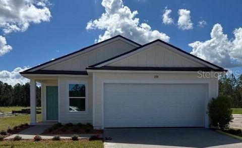 Photo of 858 Grand Reserve Drive, Bunnell, FL 32110 (MLS # FC313003) Photo of 858 Grand Reserve Drive, Bunnell, FL 32110 (MLS # FC313003)