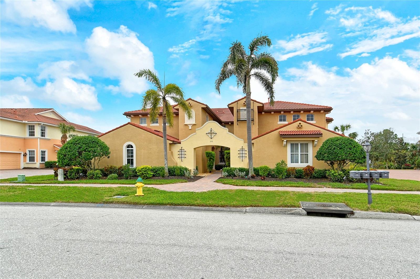 This gorgeous condominium with hurricane shutters and complete privacy is a masterpiece of design and comfort and is designed for those seeking an elevated lifestyle. Nestled in the heart of an award-winning golf community, this exquisite home combines modern luxury with serene natural beauty. Perfect for golf enthusiasts, pickle ball and tennis players, for socializing at the Tiki Bar at the resort-style pool, or for someone who just likes to walk along the trek outdoor walking trails along the Myakka River. This condominium offers a Grand Entryway, vaulted ceilings with crown molding elegantly lining tray ceilings and high impact windows in every room. The diagonally set floor tile, Plantation Shutters, Sunscreens with upscale window treatments, designer ceiling fans show off the functional Open Floor Plan. Three huge sliding glass doors bring in that Florida sunshine that we all crave. The Gourmet Kitchen boasts custom cabinetry, Vintage-White Quartz countertops, pull-out drawers for pots and pans, stainless steel appliances, Angora Herringbone backsplash, huge, updated breakfast bar and farmer sink, garbage disposal, soft-close drawers, spice drawers and new Moen faucet. The luxury primary suite includes blonde oak rigid core vinyl plank flooring, Hunter Douglas blinds, a slider to the back lanai, a spa-like bathroom with soaking tub, walk-in shower with designer tiles and built-in sitting area, extra linen closet and expansive walk-in closet. The two other bedrooms have the same luxury cork-backed plank vinyl flooring. The laundry room includes extra cabinets, utility sink and bar for hanging clothes. The Outdoor lanai has a covered patio, outside pavers, and newly re-screened gnat-proof screens offering a gorgeous private view of water and a haven for many birds and wildlife. Get ready to grill in your own oasis of nature with a perfectly landscaped yard. The newly painted garage floor offers parking for two cars, or one car plus a golf cart. Venetian Golf and River Club offers a State-of-the-Art Clubhouse for fine dining, lounges, Tiki Bar, and event spaces. Enjoy the Wellness Center with fully equipped fitness center, yoga studio and tennis shop, a resort-style swimming pool, lap pool and Bocce ball area. Social Events include year-round activities, including tournaments, dances, fashion shows, a sports bar to watch your favorite teams, and many more community gatherings. This development provides 24/7 Security with gated entry and round-the-clock security drivers. The Championship Golf Course features pristine fairways and breathtaking views and is an optional separate membership. Conveniently located near I-75, beaches, top-rated schools, boutique shopping, museums, great restaurants, the thriving Venice Island with craft fairs, farmers markets and music, while still offering a peaceful retreat in nature. This condo has it all! Come see this upscale condo and begin living this wonderful lifestyle with friends and family in sunny Venice, Florida!