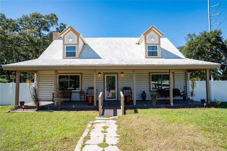Relax, you’re Home! Custom Built, Beautiful Renovated CEDAR Log Cabin that brings the mountains to Florida! Complete with rocking chair-ready 40 ft long front porch, fireplace and large shaded landscaped lot. Step inside and be greeted with silence from thick Cedar log walls, solid Cedar doors & ceilings, and see exquisite wood craftsmanship with real antler bone accents throughout the home. Nestle in front of the stone wood burning fireplace on a cold night with hot cocoa in the open concept great room that opens to the dining room and large kitchen that has custom Cedar cabinets & tile countertops, SS appliances that includes a Double Dutch oven & deep freezer, double pantry with storage, and separate laundry room. Tile throughout first floor. Light candles and relax in the downstairs NEW updated bathroom with lighted jacuzzi tub, imported Italian stone tile, quartz countertop and lighting. The Cedar stairs lead upstairs to Cedar hardwood glazed floors & ceilings in the 2 extra-large quiet bedrooms across the hall from each other for privacy. The 2nd bathroom has imported Italian stone tile from floor to ceiling, Quartz countertop and NEW lighting. Backyard is perfect for relaxing & entertaining with a large patio and plenty of yard space. Enjoy your hobbies in the 10x20 shed with roll up door, electric, ac, shelves tables, insulated including ceiling, & separate fuse box, With connected carport (11’ w x 25’L x 7’h ) with new paint, roof/2025, & high tech security light. 
List of upgrades: Pest Control: Orkin full service with termite installation, 2023 roof with 90% heat reflective/hurricane proof silicone paint, AC: 2023 3 ton with 10 year transferrable warranty, Water Heater 2022, Whole house Electric Upgraded 2020, Outside paint: Overdeck weather & insect proof 2024, Double Gate Fence: 2024 with 15 year transferrable warranty, Windows: Side slide, Double pane hurricane proof, architectural tint with 90% heat reflective one way see through, from Home Depot with 15 year transferrable warranty, 9 New Hunter ceiling fans, Security System installed, Covered NEW Trex Deck weatherproof front porch & ramp, 10x20 shed with roll up door, electric, ac, shelves tables, insulated including ceiling, & separate fuse box, With connected carport with new paint, roof, high tech security light 11’ w x 25’L x 7’h. 10/29/25 survey available. Handcrafted furniture can be purchased separately. Great location, convenient to Winter Haven/Lakeland, as well as the Polk Parkway, that leads to I-4 Tampa/Orlando. This is one of the most unique, interesting, beautiful homes that has been on the market for a long time so don’t waste time and hurry to see it before it’s too late!