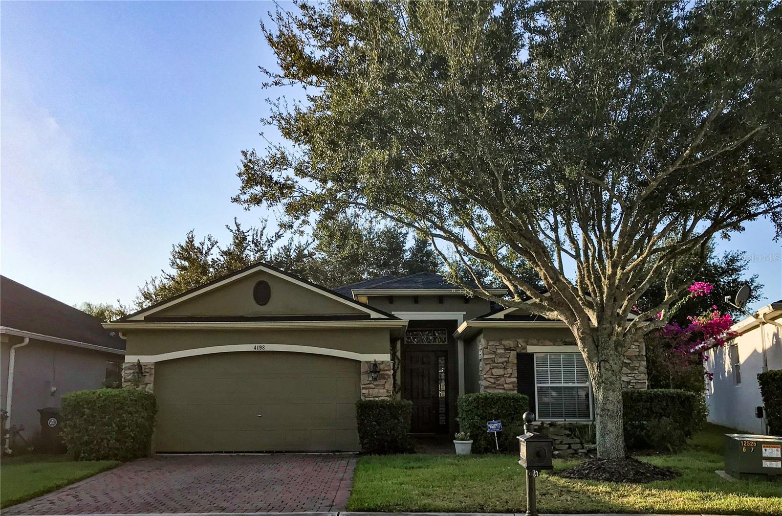 This 3-bedroom, 2-bathroom home is located in the sought-after community of Sanctuary. The kitchen features an eat-in space, stainless steel appliances, and plenty of natural light. Enjoy laminate flooring throughout the common areas and carpeted bedrooms, along with a washer/dryer hookup and a utility sink in the garage. The split floor plan includes an open patio off the living room. This house is conveniently situated Oviedo, close to restaurants, parks, and UCF. Welcome home! Please note that RentSpree applications will not be accepted. Residents will be enrolled in the Resident Benefits Package (RBP) for $39.95 per month; more details will be provided upon application. Small to medium pets are permitted. There is a separate HOA community fee of $250.
