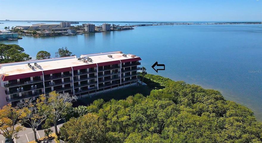 THE DUNEDIN GULF FRONT CONDO YOU'VE WAITED FOR! Prime corner unit with sweeping water/sunset/dolphin views in 4 directions, from Caladesi Island to Anclote Key! Watch the weekend boats parade by heading out from the three marinas nearby! Spacious, airy and bright - big enough to downsize into- and you're not giving up your outdoor living space with the HUGE 40' wraparound balcony (yes that is ALL private balcony in the photo). Beautifully updated and only used part-time, with a beautiful light-wood custom kitchen, complete with quartz counters, updated bathrooms++. fully furnished  Feel comfortable knowing you have roll-down hurricane shutters, a new roof and an inspected,  structurally updated balcony!   DUNEDINS #1 ALL-AGE COMPLEX - WALK TO TRAIL, RESTAURANTS & SHOPPING! ON SITE BEACH, WATERFRONT PARKS, HEATED POOL, TENNIS, FITNESS CENTER & MORE!