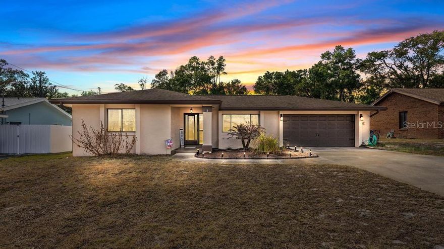 Discover the highly sought-after Breezewood neighborhood in Orange City, Florida—this charming 2-bedroom, 2-bathroom home offers over 1,200 square feet of comfortable living space, perfect for relaxed Florida living. Step inside to an open-concept layout where the living room flows seamlessly into the dining area, complete with a sliding glass door that opens to a bright and inviting Florida room—ideal for year-round enjoyment or entertaining. The kitchen features tile flooring, abundant cabinetry, a built-in oven, smooth flat cooktop, and a convenient pass-through window to the Florida room. Recent updates include fresh paint in the kitchen (2024), updated bathrooms, and new flooring throughout the kitchen and bedrooms—giving this home a modern, move-in-ready feel. Outside, enjoy the enclosed porch with glass windows, plus an attached storage shed (also with glass windows) overlooking the backyard. The spacious 10x16 area provides plenty of room for outdoor relaxation or gardening. A separate 10x12 room off the oversized garage—previously used as a workshop—offers fantastic bonus space for hobbies, storage, or a home office. Additional highlights include an oversized garage for extra parking or projects. Prime location puts you just minutes from top-rated schools, shopping centers, a variety of restaurants, and easy access to I-4 for commuting to Orlando, Daytona Beach, or beyond. This isn't just a house—it's the perfect setting for your next chapter in a friendly, desirable community. Don't miss out—schedule your private showing today!