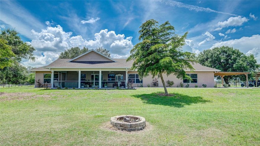 SAY HELLO TO PRIVACY!!! Bring Your Horses or Cows! This is a Hard to find secluded 10 acre estate located just 8.5 miles from I-75 and a short drive to the World Famous Siesta Key Beach! NO HOA or CDD! Zoned OUE1 gives you LOTS OF OPTIONS!! The House was Built in 1998, renovated in both 2013 and 2018, and was just RECENTLY PAINTED. This home overlooks a stocked fishing pond with a wooden dock and built-in Adirondack chairs. Plenty of space for animals and horses. This custom built home in a lovely neighborhood was, according to the previous owner, built to have a second floor added if desired. With over 3,000 square feet under air, it is a very practical open house layout with vaulted ceilings and panoramic views from every window and patio of pasture, ponds, woods and there are no other houses in sight! The front screen enclosed porch also has a spa. The rear brick-paver patio faces west offering amazing sunsets over the pastures and visiting wildlife. The Oversized Garage/Barn is Large Enough for a Car Collection or to Store Tractors and Farm Equipment. It also has a Fully-Equipped Air Conditioned Gym. The home has many upgrades as well such as granite countertops, simulated wood plank tile floors, stainless appliances, custom solid wood cabinets, breakfast bar, and decorative stone fireplace. The SPLIT BEDROOM plan has a spacious master bedroom with walk in closet and jetted tub. The other two bedrooms with walk-in closets are on the other side of the living room with the second bath. There is a man cave/game room with a bar for parties and events or just watching the game on a Sunday with friends. Laundry room with storage is located off of the kitchen. Other structures on site include an oversized metal barn/garage/workshop, RV site/carport, storage shed, detached well-lit 2-car carport, a 2-car carport attached to the house, and chicken coop. This property is completely hidden from the main road making it VERY PRIVATE! Make an appointment today!!