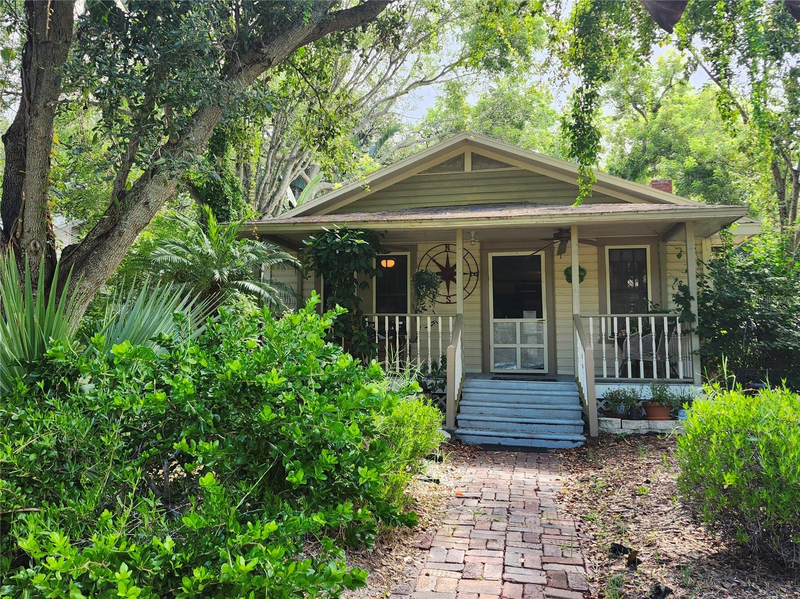 This charming Old-Florida bungalow is full of character and warmth. Featuring 2 bedrooms and 1 bathroom with plenty of living and dining space, the interior is thoughtfully detailed and it perfectly showcases old-Florida style and character; a detached 2 car garage with the entrance to the back alley, has great potential to be renovated as an ADU for a loved one, or an investment opportunity. While outside, the inviting yard provides space for relaxation under the lush trees, or entertaining under Florida’s sunshine. With the Pinellas Trail entrance just steps away, the opportunity for engaging on more physical activities is endless. Plus, being close to award-winning Gulf beaches, shopping, dining, and more, make this property even more desirable. Whether you’re a first-time buyer, or looking for a family space expansion, or perhaps you're seeking an investment opportunity, this home has the space and all the potential. Don’t miss your chance to make this Largo gem yours! Call today!