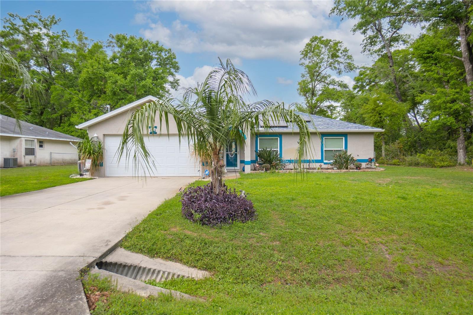 This COMPLETELY REMODELED home sits in the desirable Inverness Highlands & features 3 beds, 2 baths, a 2-car garage, 0.44 acres, & a HUGE 45x26 detached metal garage that can store TWO SEMI TRUCKS. Upon entering the sleek home, you are greeted w/ an open & spacious living room w/ cathedral ceiling, dimmer/switches, smart locks & thermostat, sliding glass doors leading to the back porch, a dining room w/ brilliant light & views, & vinyl tile throughout to exclude a tasteful & elegant feel. The tastefully remodeled kitchen boasts granite countertops w/ plenty of counter space, an enormous island that includes seating, a large farm sink, Brand New Tile Flooring, NEW smart non-fingerprint s/s appliances, gorgeous backsplash, custom wood cabinetry w/ soft close features, a lazy Susan, pull out drawers & crown molding. This split floor plan offers an owner's suite that has a large walk-in closet & normal closet & an ensuite bathroom. The light and airy owner's bath features a custom double vanity, bidet, & a custom glass walk-in shower tiled from floor to ceiling w/ hidden shelving. The sizable guest bedrooms each have large closets & a good deal of lighting. The modern & bright guest bathroom features a tub/shower combo tiled from floor to ceiling & custom glass doors, granite counters, a custom vanity, & a bidet. The exterior of the home features a screened lanai w/ impeccable views of the yard, a she-shed w/ 2 lofts, dog doors, outdoor lighting, irrigation, underground 500 gallon propane tank connected to the whole home generator, 2022/2023 solar, & a HUGE detached garage w/ 50-amp & 2 30-amps, & a RV hookup. Be sure to check out our 3D Matterport Interactive Tour and Video! Roof 2020.