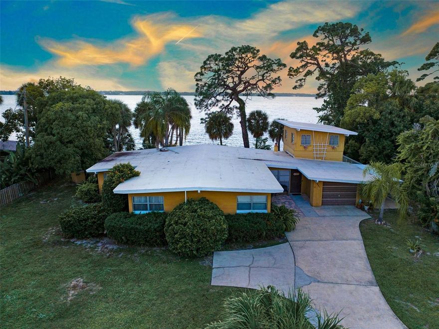 Experience the charm of mid-century design with this iconic 1950s riverfront retreat—a rare opportunity to own over 100 feet of direct Indian River frontage on a sprawling .41-acre lot. This three-bedroom, two-bath residence captures the essence of vintage Florida living, featuring warm wood ceilings and breathtaking panoramic views of the river. Step outside to enjoy spectacular sunsets and an ever-changing display of Florida's coastal wildlife, all from your own backyard paradise. With its timeless architecture, serene setting, and endless potential, this property offers a unique opportunity to renovate or reimagine into your dream waterfront estate. Homes like this rarely come available—a perfect blend of history, character, and location along the sought-after Indian River.