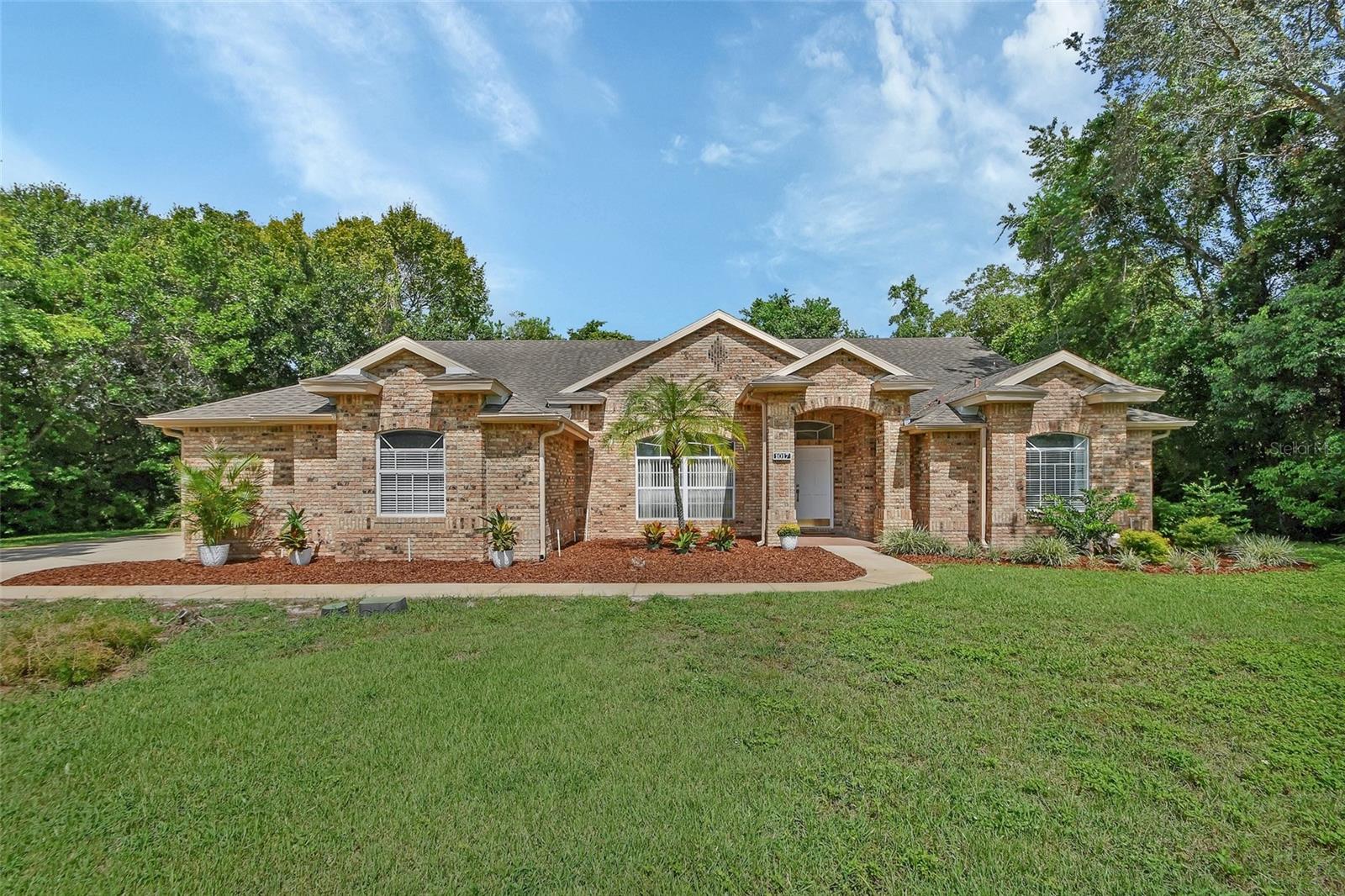 Beautiful solid Brick 3 bedroom 2 bath home with .62 acres located on a cul-da-sac in Sterling Park Deltona! If your looking for a great home with a fantastic layout, side entry garage and lots of privacy, look no further because here is the home for you! Move in Ready with New Flooring, updated kitchen with Granite and brand new stainless steel appliances, updated bathrooms, all new paint throughout the entire home. New blown in insulation and Fresh landscaping. Very low HOA, and you wont find anything cookie cutter about this neighborhood with each home spread out with equally beautiful homes within the neighborhood. Bring the Boat and RV as they are welcome in this neighborhood behind your fence. Water heater is a 2021, Roof is 13 years old but in great shape and the AC is a 2017. The home has been completely Re-Plumbed. Well on the property for Irrigation to save on your water bill! You can hop on I-4 with a short 5 minute drive for your work commute or head over to our Beautiful beaches with only a 30 min drive. Orlando and all it has to offer with all the theme parks are only a 45 min drive away. This is a fantastic location with being only a few minutes away from all the great restaurants and shopping and medical facilities that Orange City has to available. This neighborhood is one of Deltona's hidden Gems! Give us a call today for your private tour of this home!