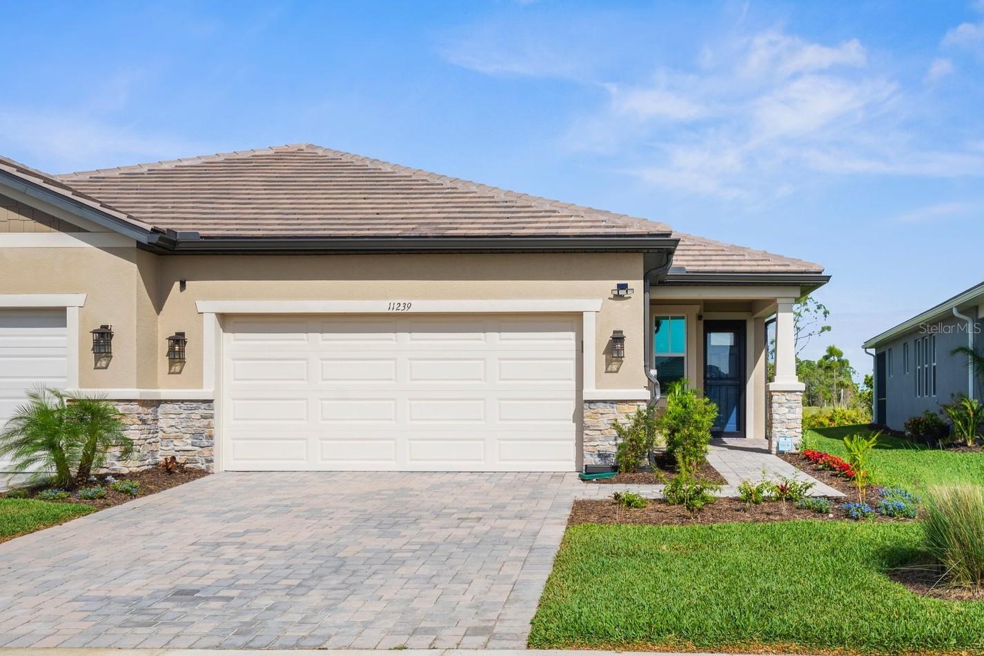 You’ve been waiting for this one! Imagine unwinding in this beautiful bright villa, offering peaceful and serene preserve and peek-a-boo lake views. This open floor plan seamlessly integrates the kitchen and living room, placing you at the center of the home and allowing you to enjoy every moment with family and friends. A nice choice of a neutral coastal color palette provides a calming, homey atmosphere. The kitchen features a walk-in pantry, Whirlpool appliances and a convenient flush island with seating so you can watch someone else do the dishes! The owner’s suite has a tray ceiling accented with crown molding, walk-in closet, double sink vanity, toilet closet, and an amazing walk-in shower. The second bedroom is just across the hall from its own bathroom, with two nearby linen closets for added storage.
There are numerous upgrades, including plank style tile flooring, an attractive flat tile roof, ceiling fans and wood blinds in addition to a storm/screen front door. A huge laundry room with washer and dryer included provides plenty of space for convenience and organization. The two-car garage is equipped with a utility sink and overhead storage. For added security and peace of mind, the home includes a Blink camera system for both the front and back of the house, as well as hurricane IMPACT WINDOWS to ensure safety during storm season. Also situated close to the end of a quiet cul-de-sac street surrounded by nature. The current owners have added additional tropical landscaping for an extra special feel.
Located within a brand-new resort-style community with a soon-to-open 21,000 sq. ft. clubhouse and amenities you will enjoy: 2 pools, 9 pickleball courts (including a competition stadium court), and a full-time activities director. You’ll find fun places to relax at the café and bar. Plus paw parks for your furry friends, and more. The community’s prime location is just minutes from Downtown Wellen Park, where you’ll find waterfront shopping, dining, entertainment options plus miles of trails for walking and biking. Additionally, you’re only a short drive away from beautiful beaches, golf courses, parks, and recreational trails. Brightmore offers an active 55+ lifestyle in a low-maintenance, gated environment, making it the ideal place to enjoy all that Southwest Florida has to offer. QUICK CLOSE AVAILABLE! Some furnishings negotiable.
GOLF CART INCLUDED IN THE SALE!!!!!