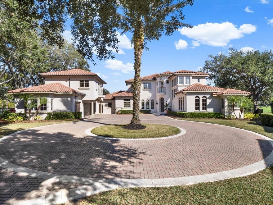 A perfect blend of Mediterranean and contemporary Transitional design, where timeless elegance meets luxurious comfort and warmth. This incredible estate resides on nearly three quarters of an acre, situated on hole #3 of Lake Nona Golf & Country Club’s renowned, Championship Golf Course. Enjoy your morning coffee or cold mimosa amidst your sunrise views above multiple fairways, beautiful conservation areas and glistening golf course ponds. Driving up to this impressive property, you will appreciate the long paver, age old oak tree-lined, circular driveway, along with mature landscaping and gorgeous architecture. This estate features essentially two houses in one with the Main House (5,159 SF) and full Apartment (780 SF) above the Garage to total nearly 6,000 SF of open & spacious living space with an oversized 3-car garage plus full golf cart garage, complete with cabinetry & tons of storage. The Main House (4 BR, 3 Full Baths, 2 Powder Baths) features the primary suite & secondary BR ensuite downstairs along with a dedicated office, powder bath, large utility room and all living spaces. All living areas on the first floor are each meticulously designed with beautiful architectural trim, marble flooring, coffered ceilings and lighting features, all with views of the front and back of the house and tremendous natural light. The primary bedroom has beautiful ceiling beams, his & her closets, a lovely bathroom with jetted tub, steam shower, separate vanities with marble counters and marble flooring. The dedicated office has custom cabinetry with stylish and elegant storage, a custom, Venetian plaster ceiling, beautiful wood inlay detail on the marble floor and a gorgeous chandelier. The powder bath is so unique and features a gorgeous tile accent wall, a breathtaking textured, glistening wallpaper and a granite waterfall sink. The Chef’s Kitchen features an oversized island, tons of storage, top of the line appliances, including an 8-burner Viking gas stove, 42-inch wood cabinets, gorgeous marble countertops and beautiful pendants over the island. Upstairs in the Main House you have a Huge Bonus/Game Room, complete with wet bar, a Powder Bath and 2 additional BR’s that share a Jack & Jill Bath. From the Bonus Room and 1 BR, you can access the generously sized balcony which offers breathtaking views of your own property, including your gorgeous private pool and spa with tremendous deck space, fully fenced backyard and, of course, the most breathtaking golf course, conservation and water views. Connected to the Main House through a quaint open courtyard and covered walkway, and with its own private entrance from the front and/or the garage, enjoy your Apartment above the Garage, complete with 1 Huge Bedroom, Walk-in Closet, Full Bath, Living Room with Kitchenette and a private Juliette balcony overlooking the gorgeous paver driveway. While there are so many places to enjoy inside, you will love the outdoor areas with vast amounts of yard to play, a swimming pool & spa with plenty of deck space for relaxing, eating, drinking and entertaining. Enjoy all A-rated schools, located minutes from Orlando's International Airport, Medical City, Boxi Park, shopping, restaurants, the 417 Greenway & 528 Beachline. Don’t miss out!