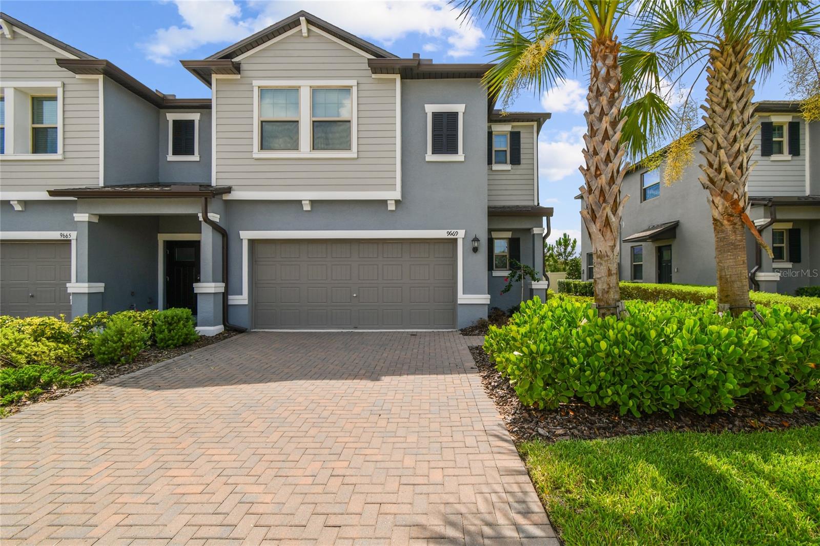 Now Available for Rent – Luxury End-Unit Townhome in Resort-Style Connerton! Discover the perfect blend of comfort, style, and low-maintenance living in this beautifully maintained 3-bedroom, 2.5-bathroom end-unit townhome with a 2-car garage, located in the highly sought-after community of Connerton. With 1,861 square feet of thoughtfully designed living space, this spacious two-story home is ideal for professionals, families, or anyone seeking a vibrant rental lifestyle with access to top-tier amenities. As you arrive, a charming brick paver driveway and private side-entry welcome you into a bright and inviting open-concept layout. The spacious grand room features an elegant accent wall and flows seamlessly into the dining and kitchen areas—perfect for entertaining or relaxing at home. The chef-inspired kitchen includes granite countertops, abundant cabinet space, a breakfast bar, and modern finishes, offering both style and practicality. A convenient half-bath and direct garage access complete the main floor. Upstairs, enjoy a versatile loft with custom built-in shelving and a cozy window bench—ideal for a home office, reading nook, or play area. The primary suite serves as a peaceful retreat, complete with a decorative accent wall, spacious walk-in closet, and an en-suite bathroom with granite countertops and high-end finishes. Two additional bedrooms provide flexible space for family, guests, or remote work, while all bathrooms feature matching granite surfaces for a polished, cohesive look throughout. This rental includes water, irrigation, and landscaping services, giving you a truly maintenance-free lifestyle. Take advantage of Connerton’s award-winning amenities, including a clubhouse, resort-style pool and splash pad, fitness center, scenic nature trails, parks, playgrounds, and a full calendar of year-round community events. Located near top-rated schools and with easy access to shopping, dining, and major highways, this home offers everything you need—right where you want to be.