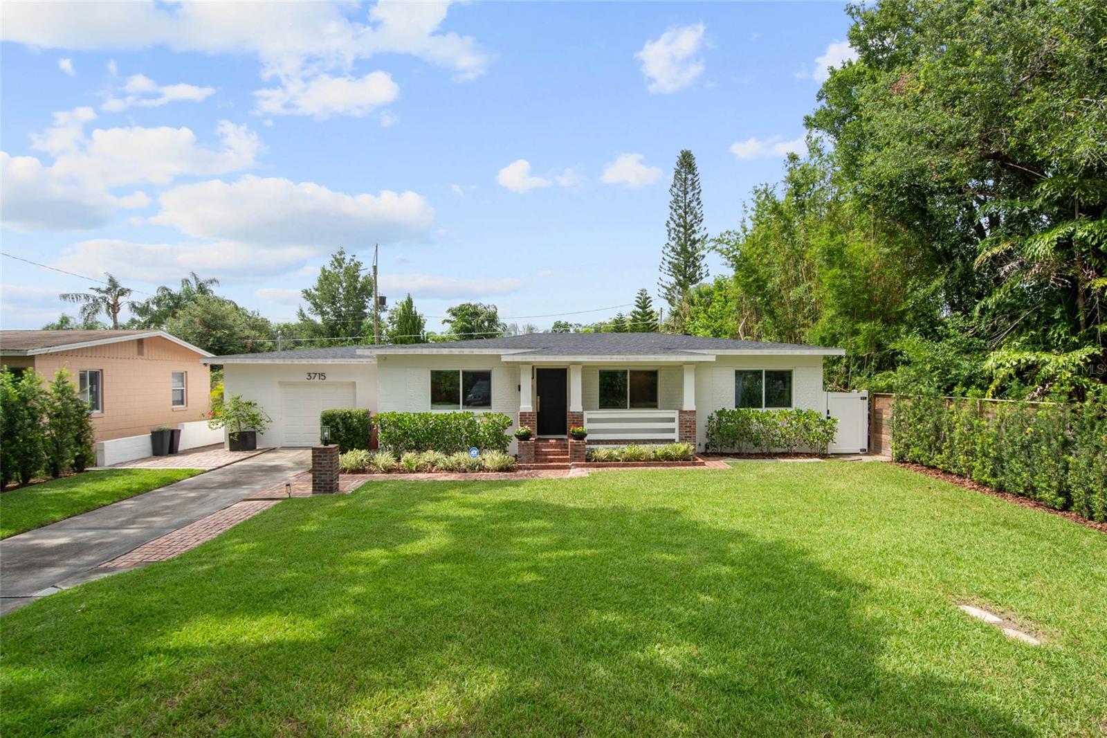 Sophisticated and fully renovated, this 3-bedroom gem in the heart of Audubon Park offers the ideal fusion of modern luxury and timeless charm. Thoughtfully redesigned for open-concept living and effortless entertaining, the home features rich hardwood floors and an abundance of natural light pouring through new Pella windows. The custom chef’s kitchen impresses with sleek cabinetry, premium appliances, and high-end finishes, and opens to a sunlit dining room with picture windows overlooking the expansive, fully fenced backyard. The spacious primary suite is a true retreat, complete with custom built-ins and a beautifully reimagined bathroom showcasing designer details and classic elegance. With expansive living spaces and an inviting layout, every room feels light, bright, and livable. Just steps from East End Market, neighborhood shops, and Audubon K-8, this is a rare chance to own in one of Orlando’s most walkable and sought-after communities.