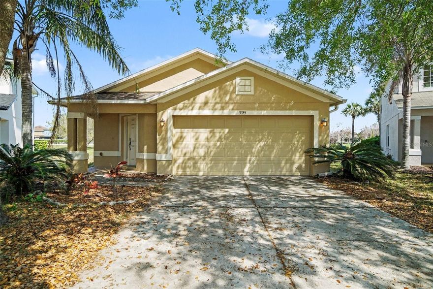 One or more photo(s) has been virtually staged. Dreams do come true in Florida! Fall in love with this 3-bedroom, 2-bath home with a 2-car garage located on a quiet cul-de-sac with peaceful pond frontage in the desirable Concord Station community of Land O' Lakes. Inside you will find ceramic tile flooring throughout and a beautifully remodeled kitchen (2021). All kitchen appliances, plus the washer and dryer, are included, making this home truly move-in ready. Major updates have already been completed with a new roof and gutters installed in 2024.

Step outside and enjoy tranquil pond views or take a short one-block walk to the Concord Station Recreation Center featuring a resort-style community pool, playground, tennis courts, basketball court, and recreation facility. All three assigned public schools are A-rated and conveniently located nearby, approximately 0.3 to 1.4 miles from the home. 

Homes in this location rarely offer this combination of updates, views, and walkable amenities. Schedule your showing before it is gone.