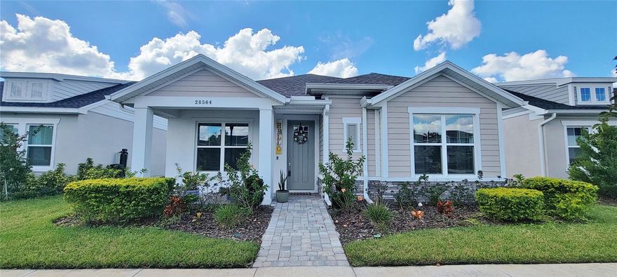 Persimmons Park in the Wesley Chapel area offers this almost brand new 3 bedroom, 2 bath + OFFICE/STUDY single family home with over 2000 square feet of living space! The main living area is flooded with natural light & features an open concept, making a great space for entertaining. NO CARPET HERE - Engineered Hardwood flooring throughout with ceramic tile in the bathrooms & laundry room. The gourmet kitchen is fit for a chef with an OVER-SIZED ISLAND complete with seating & cabinet space, built-in WALL OVEN, 5-burner COOK TOP, CLOSET PANTRY, QUARTZ counters & a stainless steel farmhouse style single-basin sink. The primary bedroom features an en-suite bathroom with a LINEN CLOSET, DOUBLE SINK VANITY, WALK-IN SHOWER and expansive WALK-IN CLOSET. The SPLIT BEDROOM plan provides privacy for everyone with bedrooms 2 & 3 sharing the 2nd full bathroom. The office/study is equipped with double glass French doors and is a perfect space for your home office, playroom, craft room or whatever your needs may be! The indoor laundry room is very spacious & offers additional storage space. The extended SCREENED LANAI features brick pavers & a built-in wet bar area with a sink, counters & storage space. The attached over-sized 2 car garage provides plenty of space for parking & storage. Enjoy the COMMUNITY AMENITIES which include a community POOL, PLAYGROUND, picnic tables with GRILLS & a dog park. This location is prime in a top-rated school zone & close to everything you need from shopping at Wiregrass Mall or the Tampa Premium Outlets to plenty of restaurants, medical facilities & easy access to I-75 interstate. ** AVAILABLE FOR NOVEMBER MOVE IN ** PETS w/ OWNER APPROVAL.