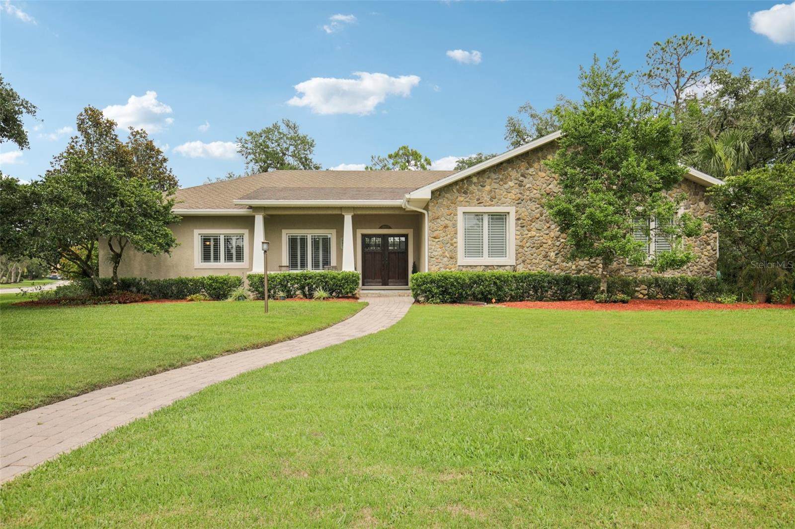 Meticulously maintained Spivey Construction custom-built home located in the highly sought-after Mill Creek community. This exceptional residence offers the perfect blend of luxury, efficiency and comfort on a spacious corner lot homesite bordered on 2 sides by conservation. Step inside the front French doors to discover a light-filled layout featuring hurricane-rated Pella windows and lanai doors, an open-concept living space and vaulted ceilings. The chef’s kitchen is a culinary dream, boasting a Frigidaire electric cooktop, KitchenAid built-in oven and microwave, warming drawer, and two-drawer dishwasher. A Frigidaire commercial-grade refrigerator and freezer add industrial-level performance and storage. Butler's pantry affords ample storage space. For added convenience, a 6-gallon electric water heater is tucked beneath the kitchen sink. Perfect for entertaining or enjoying simple meals with built-in kitchen table and separate formal dining room. Enjoy year-round peace of mind during power outtages with a Kohler 20KW automatic whole-house generator powered by a buried 500-gallon propane tank. Comfort is ensured with two air conditioning systems equipped with ultraviolet light and air purifying systems (updated in 2019 and 2022). Additional highlights include attic isonene insulation, a tankless propane water heater, premium roof shingles with waterproof underlayment, and a central vacuum system (2021). Three bedrooms and bonus room office with Murphy bed, provide plenty of sleeping space. Spacious primary suite features ample natural light, laminate floors, French doors to screened-in lani and pool, large walk-in closet and ensuite primary bathroom with dual sinks, toilet fitted with bidet seat and large stone-walled walk-in shower. The outdoor oasis features a screened lanai with in-ground pool. Ample covered seating area ideal for enjoying outdoor barbeques. Keep your lawn looking great with an irrigation system using reclaimed water. This one-of-a-kind home is ideal for those seeking quality construction, modern systems, and serene Florida living. Deed-restricted Mill Creek features low HOA fees and no CDD. Close to schools, parks, Lakewood Ranch, UTC mall and more. Schedule your private showing today!