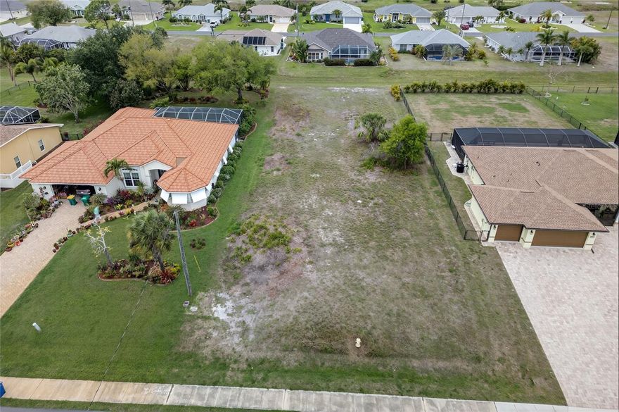 Welcome to your future home in sunny Southwest Florida! This cleared and buildable oversized lot is ready for your custom dream home, with plenty of space to add a pool and create your own private oasis. Nestled in a vibrant, deed-restricted community, you’ll enjoy access to five nearby golf courses, along with parks, playgrounds, and recreational courts, plus a full calendar of events happening year-round.
Conveniently located within 1.5 hours of four major airports and just 3.5 hours from world-famous attractions like Disney and multiple cruise ports, this property makes travel and hosting visiting family and friends a breeze. Outdoor enthusiasts will love the approximately 30 miles of freshwater canals, lakes, and ponds throughout the area—perfect for fishing, kayaking, and canoeing, all surrounded by natural Florida wildlife.
This homesite is ideally positioned with a 50-foot greenbelt behind it, offering added privacy and scenic views. Located in Flood Zone X, no flood insurance is required. The community also features a designated storage area for boats, trailers, and RVs for an additional fee. Just a short drive away, you’ll find beautiful Gulf beaches, along with a wide variety of dining and shopping options.
Build now or buy now and build later.  This property offers more than just a place to build—it’s an opportunity to enjoy the Florida lifestyle for years to come.