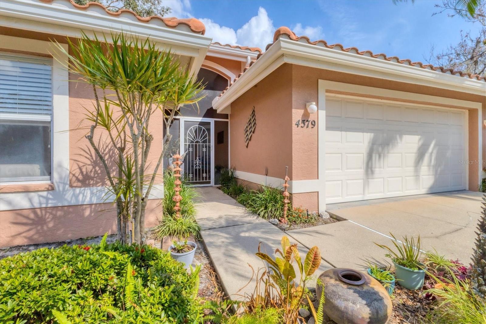Say Hello to a Good Buy! Grounds maintained 3BD/3A one-story home nearly 2100 sqft under air with serene preserve views. Stunning travertine look floor tiles throughout. Modernized, sleek kitchen. Chefs will love the gas cooktop. Charming primary suite and bath with dual sinks, soaking tub, and stand-alone shower. Towel warmer for cozy drying. Flexible living spaces, home office, convertible bonus room, and spacious Florida Room with tranquil views. Centrally located south of the University Corridor in Sarasota County offers effortless access to shopping, restaurants, beaches, medical facilities, and recreational activities. Longwood Run Residents say, “I love the neighborhood, the mature trees and greenspace,” “I can ride my bike or walk around the 1-mile loop or ½ mi loop.” “I love having sidewalks”. “The affordable low HOA fees are perfect for my fixed budget.” This home offers ample storage, a separate laundry room, high ceilings, three full bathrooms, 1 second primary suite, wall space for artwork, flex rooms, and a 2-car garage, which in one bundle are very rare. The setting is private and secluded. Take the next step, and you will feel completely at home.