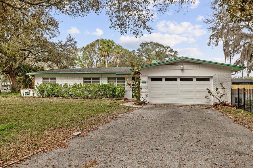 This charming 3-bedroom, 2-bathroom home features an attached two-car garage and is ideally located in the northside country club area of the Forest Hills golf course. The residence boasts terrazzo flooring throughout, a bright modern kitchen with stainless steel appliances, and a spacious breakfast bar. The dining room is separate from the kitchen, making it perfect for entertaining. You can host guests in either the living room or the den. The large primary bedroom includes an ensuite bathroom with granite countertops, and ceiling fans are installed in every bedroom. Additional highlights include a lanai and a sizeable fenced backyard with a side patio that’s ideal for cookouts. Centrally located near Fowler and Florida Avenues, this home offers convenient access to shopping, North Tampa amenities, and an easy commute to USF or the New Tampa area—the University of South Florida is just 11 minutes away. This house is move-in ready!
