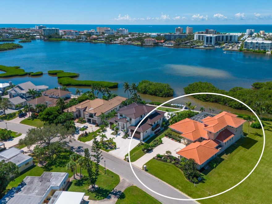 Welcome to ‘The Retreat at Tidewood’, a boater’s paradise nestled in one of Sarasota’s most desirable and secluded waterfront communities. Imagine living just minutes from downtown, fine dining, and shopping, all without the hassle of an HOA. This home offers the perfect blend of convenience and tranquility for those who love life on the water. Elevated 12 feet, this residence ensures peace of mind protection from flooding. Step inside to discover an updated gourmet kitchen with custom cabinetry and premium finishes, a spacious living and dining room, and a luxurious master suite with Venetian Plastering and his-and-hers closets. Every room on the ground floor opens directly to the pool, creating a seamless indoor-outdoor flow to over 2,500 sq. ft. of screened outdoor living — perfect for entertaining or relaxing in total privacy. For the avid boater, the property features a concrete seawall for easy canoe or kayak launching, making it effortless to explore the serene Intercoastal Waterway. Additionally, a boat yard just a short distance away accommodates larger watercraft and offers concierge services, ensuring your boating adventures are always within reach. Upstairs, a private “in-law suite” is accessible by elevator or stairs and includes three flexible rooms, full bath with tub/shower combo, kitchenette, a large walk-in closet, room to add an additional bathroom, and a screened porch overlooking the tranquil waterway, Siesta Key, and timeless sunsets. Surrounded by protected mangroves, the views are as peaceful as they are timeless. Designed for multi-generational living or hosting guests with ease, this home blends thoughtful functionality with waterfront luxury. Its location combines seclusion and convenience — tucked away in a peaceful community, yet close to everything Sarasota has to offer. The adjacent lot could also be purchased for additional acreage, offering even more space and potential. The ‘Retreat at Tidewood’ offers a once-in-a-lifetime opportunity to own a piece of paradise. This unique experience awaits you with the perfect blend of comfort, privacy, coastal beauty, and a lifestyle tailored for those who cherish the water.