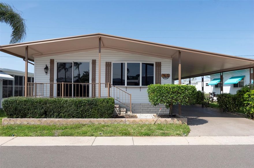 Charming 2BR/2BA manufactured home in the resident-owned 55+ community of Sunset Palms in Pinellas Park. This well-maintained home features a bright living and dining area, functional kitchen with ample cabinetry, and a relaxing Florida room for additional living space. Covered carport and storage included. The community share is included in the purchase. Sunset Palms offers a clubhouse, heated pool, shuffleboard, fitness room, and an active social calendar. Conveniently located near shopping, dining, and just minutes from St. Petersburg and the Gulf beaches.