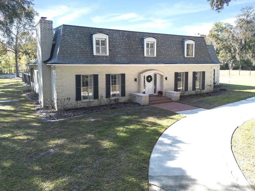One or more photo(s) has been virtually staged. Beautifully remodeled French colonial estate on 3+ acres located in the heart of Lake Mary. With over 3700 sq feet, this 5 bedroom, 4 bathroom home also features a tennis court (could be made pickleball) and an oversized swimming pool. Since this property is zoned Agricultural, it is fully fenced and ready for horses and/or cows, goats or chickens.  This estate has been completely remodeled from the ground up. From the 24x48 porcelain tile and freshly refinished hardwood floors to the elaborate molding and oversized kitchen island covered in high grade Quartzite countertops and solid wood cabinets. This property is perfect for entertaining with an open kitchen and family room that overlook the stunning yard. This property also includes a new roof, new AC units and new plumbing along with new appliances, 2 fireplaces, spacious bedrooms and renovated bathrooms. The owners left nothing to spare with this gorgeous property. Take a look for yourself and fall in love with a piece of paradise just minutes from great schools, shopping and restaurants. NO HOA!   New roof, new dual A/C, new plumbing and electric. House may be under audio/visual surveillance.