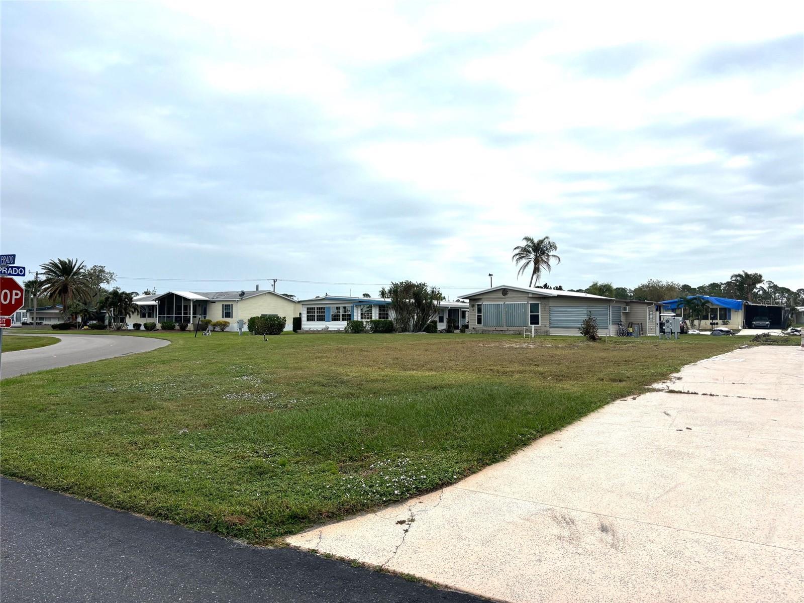 Vacant corner lot offers a spectacular view of one of our 8 beautiful lakes. It also sits across from our Clubhouse so you’ll be close one of our pools, hot tubs, sauna, gym, library, and lots of other activities! La Casa is a vibrant 55+ community that offers the ultimate Florida lifestyle. We have 974 homes nestled among a variety of native trees with spacious common grounds surrounding our eight lakes. Located between Sarasota and Fort Myers, this is a boater's dream with access to the Gulf of Mexico. It is convenient for shopping, sightseeing, golfing, fishing, and boating, as well as all the culture and elegance the Southwest Florida area is noted for. La Casa may have the best pools in the area. Our crown jewel is an extremely large, 40 X 60-foot swimming pool that is kept at a perfect 87 degrees. Our smaller 20 x 40 pool is quietly nestled between the clubhouse and the Activity Building. Both pools have adjacent hot tubs which are ideal for soaking muscles that are tired from golfing or tennis. Wireless Internet (Wi-Fi) is available at the Clubhouse, Activity Building, and Recreation Hall area where these pools & spas are located, so you can catch some rays while you catch up on your email! Sound enticing? Come for a visit to this self-contained oasis and see for yourself why La Casa is the ultimate destination for both snowbirds and year-round residents!