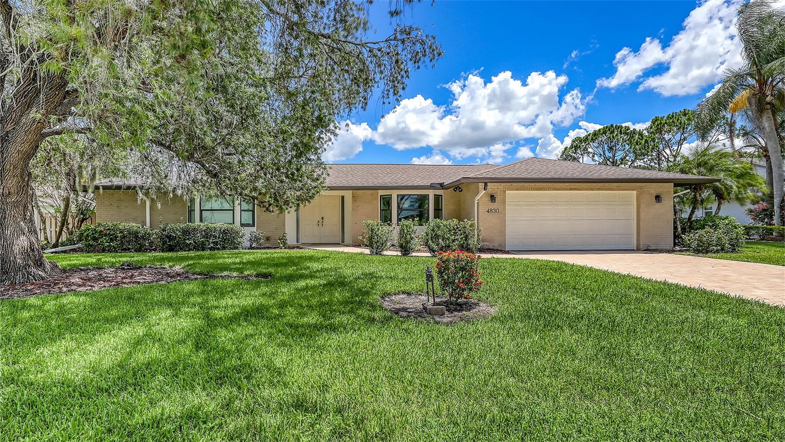 STUNNING FOUR BEDROOM POOL HOME IN THE MEADOWS WITH GOLF COURSE VIEWS! Welcome to this beautifully updated 4 bedroom, 3 bath single family home nestled in the sought-after community of The Meadows. This move-in ready gem offers a perfect blend of comfort, style, and functionality--ideal for families or those seeking a peaceful retreat with modern upgrades. Step inside to find a completely renovated interior, including a gourmet kitchen with new appliances, custom cabinetry, and updated bathrooms featuring high-end finishes. New flooring flows throughout the home, complementing the freshly painted interior and exterior. The inviting family room with a fireplace provides a cozy space for relaxation, while the separate living and dining rooms create a versatile layout for everyday living and entertaining. Enjoy Florida living at it's finest on your screened lanai with a new pool cage overlooking your private pool surrounded by new paver stones all with beautiful golf course views. The spacious laundry room, two-car garage, and new impact windows complete this well-appointed home. Located in one of the area's most desirable communities, The Meadows offers 14 miles of walking trails, a fitness center, a junior olympic pool, pickleball courts, and tennis courts. Minutes away from beaches, Sarasota's vibrant arts and cultural scene, Nathan Benderson Park, the new Mote Aquarium, the Mall at University Town Center with shopping and dining.