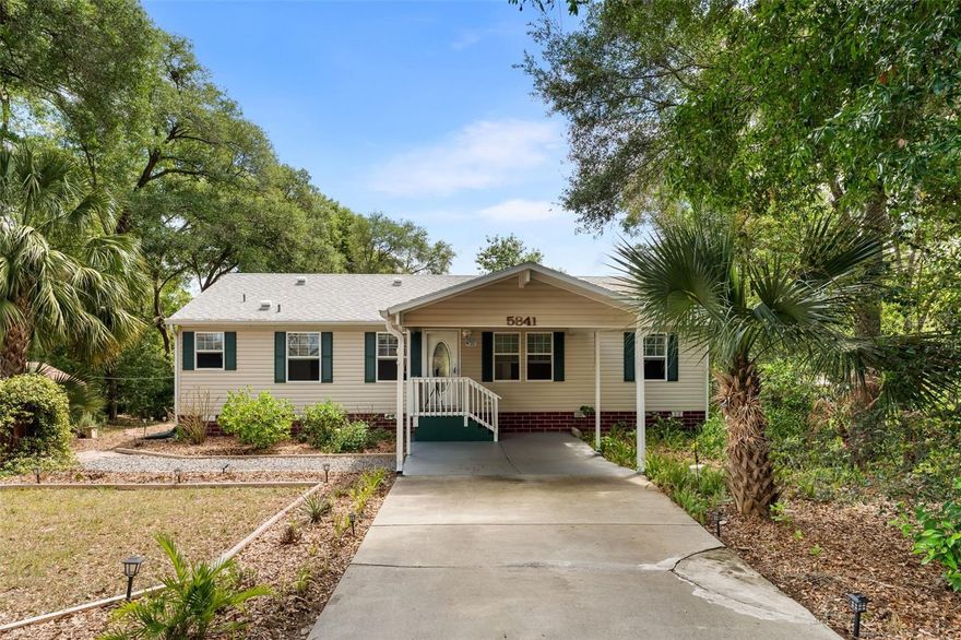 It’s the details that truly set this one apart. This beautifully upgraded 3-bedroom, 2-bath custom modular home offers a refined yet comfortable living experience, thoughtfully enhanced throughout. Inside, you’ll find new flooring with sealed edges, elegant marble window sills, Purelin countertops, double-pane windows, and a custom interior paint palette that creates a clean, modern feel. A security system is already in place, while a concrete driveway and covered 1-car carport add everyday convenience.

Step outside and discover a property that goes far beyond the ordinary. The grounds have been intentionally designed and meticulously maintained, featuring a thriving collection of fruit-bearing trees including peach, apple, lemon-lime, avocado, and more—creating your own private, productive oasis. Perfect for those who appreciate horticulture, sustainability, and a lifestyle connected to nature.

Situated on two separately parceled and surveyed lots, this property offers flexibility and future potential. One lot is cleared and shaded by mature oak trees, while both enjoy a peaceful setting near Moon Lake, where steady breezes create a refreshing, almost coastal atmosphere. The expansive backyard provides ample space to expand gardens, add additional structures, or simply enjoy the privacy and open surroundings. Zoned R-1, the property allows for a primary residence with the potential for a mother-in-law suite or additional living space.

Outdoor living is just as impressive, featuring a hot water soaking tub and outdoor shower that create a spa-like retreat right at home. A fully insulated “man cave” style shed with window A/C offers the perfect space for hobbies, a workshop, or a private office, along with two additional storage shed for tools and equipment.

Additional highlights include an assumable mortgage at low interest rate with an approximate balance of $190,000, and the property does not require flood insurance, offering added peace of mind.

If you’ve been searching for a property that blends comfort, character, and a true connection to the land—with room to grow, create, and unwind—this one delivers in all the right ways.