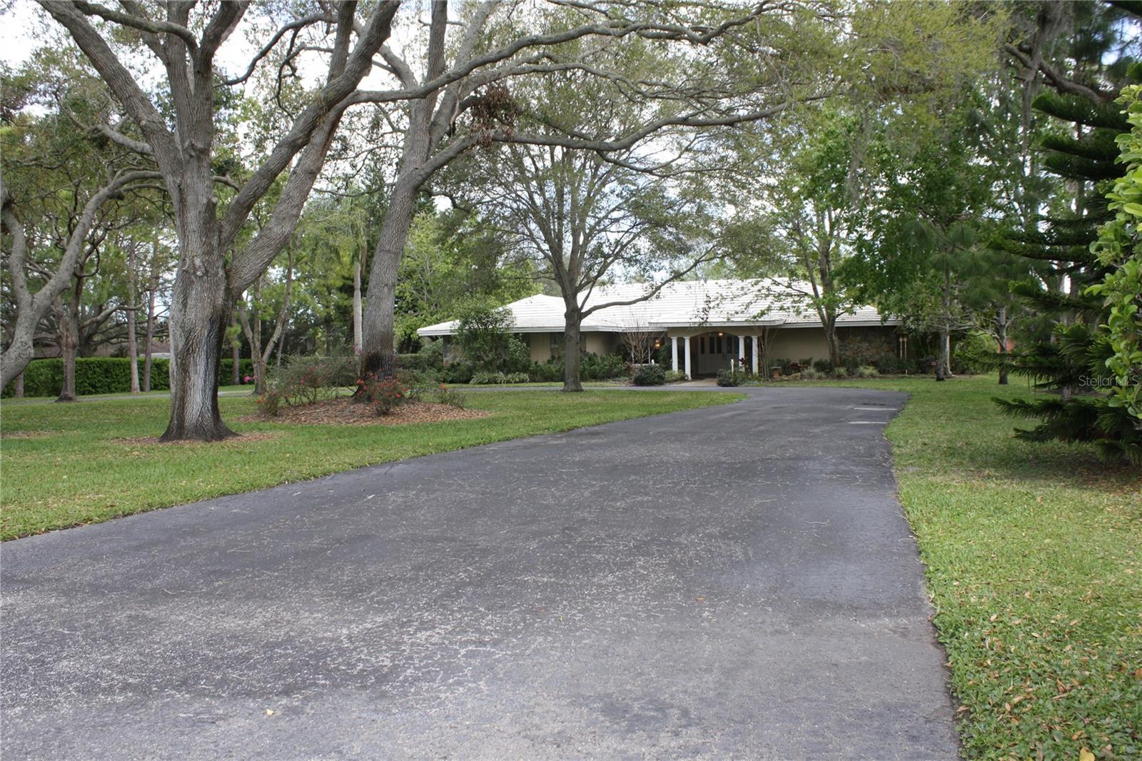 This beautifully maintained luxury home offers a rare blend of comfort and equestrian living, just minutes from the stunning shores of Indian Rocks Beach. Featuring 5 spacious bedrooms, 3 full bathrooms, and a dedicated
office or library, this residence boasts an open floor plan with sweeping views of the oversized pool and a generous 2.5-acre yard. The updated kitchen comes equipped with high-end stainless steel KitchenAid appliances
and granite countertops. Enjoy year-round entertaining in the screened-in outdoor bar overlooking the expansive pool and spa. The interior laundry room includes washer and dryer for your convenience. Horse stables are
located on the property and it’s zoned for equestrian use. Located on a quiet cul-de-sac backing up to Walsingham Park and the scenic equestrian trail, this home offers both privacy and easy access to nature. Pool and
lawn maintenance are included in the rent. This exceptional home truly has it all!