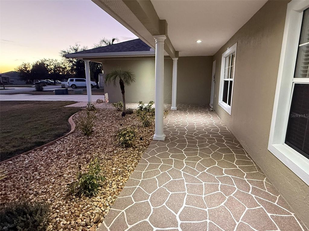 Photo of 6011 Country Walk Lane, Winter Haven, FL 33880 (MLS # TB8461684)