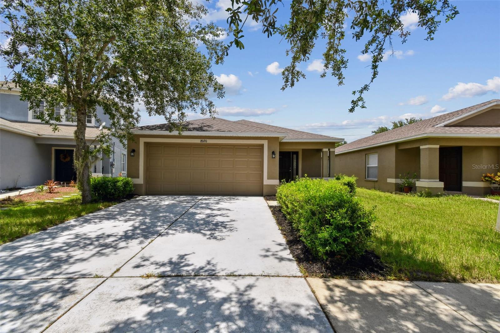 Welcome to Carriage Pointe Dr. This is a 3 bedroom, 2 bath home with a 2 car garage. Upon entering you are greeted by a open floor plan with high vaulted ceilings for an extra spacious feel. The living & dining room are filled with large windows for tons of natural light. In the kitchen you have an bar for added seating, space for an eat in dining space, and a brand new range. The primary bedroom is oversized and includes a large walk-in closet and a door to the lanai. The en-suite bath includes a jetted walk-in tub. This split floorplan creates added privacy with the remaining two bedrooms off of their own wing. Nearby the main bathroom with a shower tub combo, and the laundry room that includes the newer washer & dryer. There is a NEW ROOF in 2024, several new light fixtures, and the two car garage has a nice fresh coat of paint. Out the back sliding glass doors is a covered lanai to enjoy your morning coffee and a great sized backyard. The Carriage Point community amenities will keep you busy all year round. Featuring a community pool, basketball & tennis courts, two playgrounds, a clubhouse, and walking trails throughout. THIS HOME QUALIFIES FOR 100% FINANCING FOR FIRST TIME HOME BUYERS, call for more info!