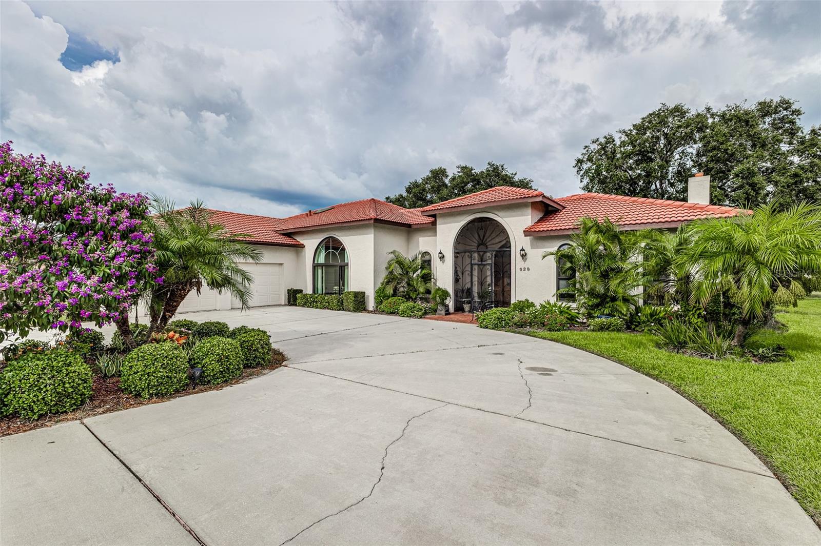 Welcome home to 529 Clubhouse Drive, located in beautiful Lake Wales. Welcome to this massive and elegant home in the Lake Wales Country Club community. Offering 3,340 heated square feet and 4,370 total square feet with 2 bedrooms, 3 full bathrooms, 1 half bathroom with 2 car garage with a gold cart garage entrance too. This stunning residence is ideal for entertaining and comfortable Florida living. Inside, enjoy a large great room with soaring ceilings, a cozy sitting room, and a stylish wet bar, perfect for hosting friends and family. The home features 2 bedrooms, including a large primary suite with dual primary bath and a private guest suite with en-suite bath and a spacious walk-in closet. Step outside to your own private oasis with a caged in-ground swimming pool overlooking golf course views. A full bathroom located conveniently on the pool patio. The expansive patio accessible from the entire back of the home provides plenty of space for outdoor dining, relaxation, and Florida-style entertaining. Located in the friendly Lake Wales Country Club community, residents enjoy access to a community clubhouse, golf, and a welcoming neighborhood atmosphere. Don’t miss this rare opportunity to own a luxury pool home with golf course views in Central Florida’s desirable Lake Wales area. Call today to schedule your private showing!