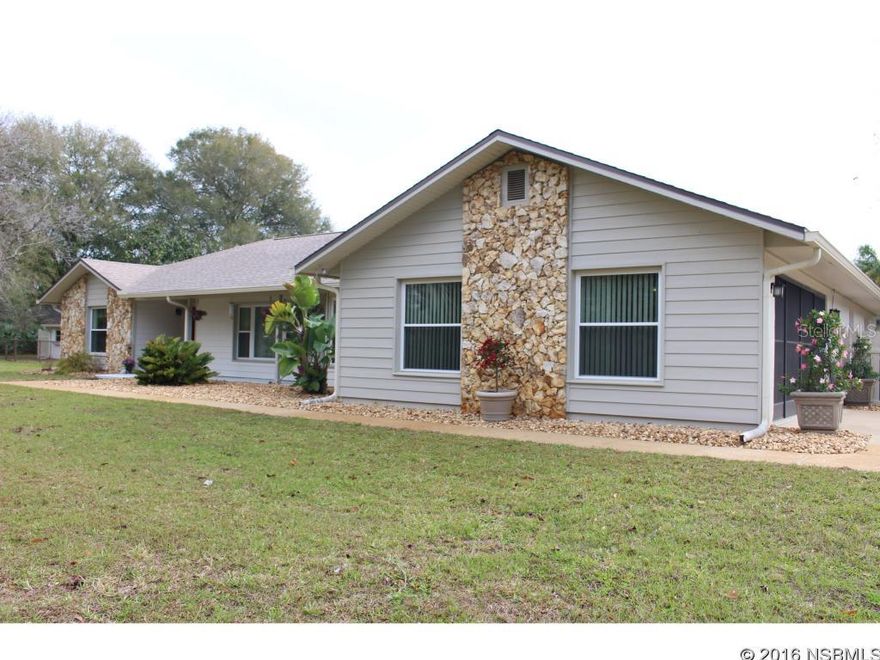 I am the one you have been looking for!! Just came on the market and  I am here waiting for you to come over and see me!! Available everyday for showings and no HOA fees for me!! I do have so much to offer.This pool home is a gem rare to be found. Country like living on 2.69 acres just minutes to famous New Smyrna beaches and shopping! 3BR, 2 Bath, Split Bedroom design;11Rooms; Kitchen, breakfast nook, formal dining room, Large Living Room , Large Walk in Pantry, foyer, Large Florida Room overlooking a 17' x 48' patio & separate enclosed pool; upgraded kitchen including appliances in June 2015, quartz countertop in the master bath; large costume built master bedroom w/walk in closet . Sitting area front porch, 2 car attached garage; Large Shed/Storage or two car detached garage w electricity and water, Screened In Salt water pool; pool deck recently recoated. Newer AC unit w/warranty!!  House and external buildings recently painted.corner lot; backyard vinyl chain link, front 3 rail wood. Home has New Wind Rated Roof, Gutters & Downspouts as of November 2014, Exterior Painting was completed August 2015, 38'x12' Florida Room 10 sliders 5.5'x6' Wind Rated Windows, all other windows are also Wind Rated.All carpeting under 3 yrs old, Tiles under 2 yrs old. Heat Pump new as of August 2015 with transferable 12 year warranty, Pavers between house and pool 2008.  - Please refer to attachments. This home has a plenty of room for Boat, Camper or MotorHome. New Garage Door Opener with Warranty as of March 2016 ;Water: City