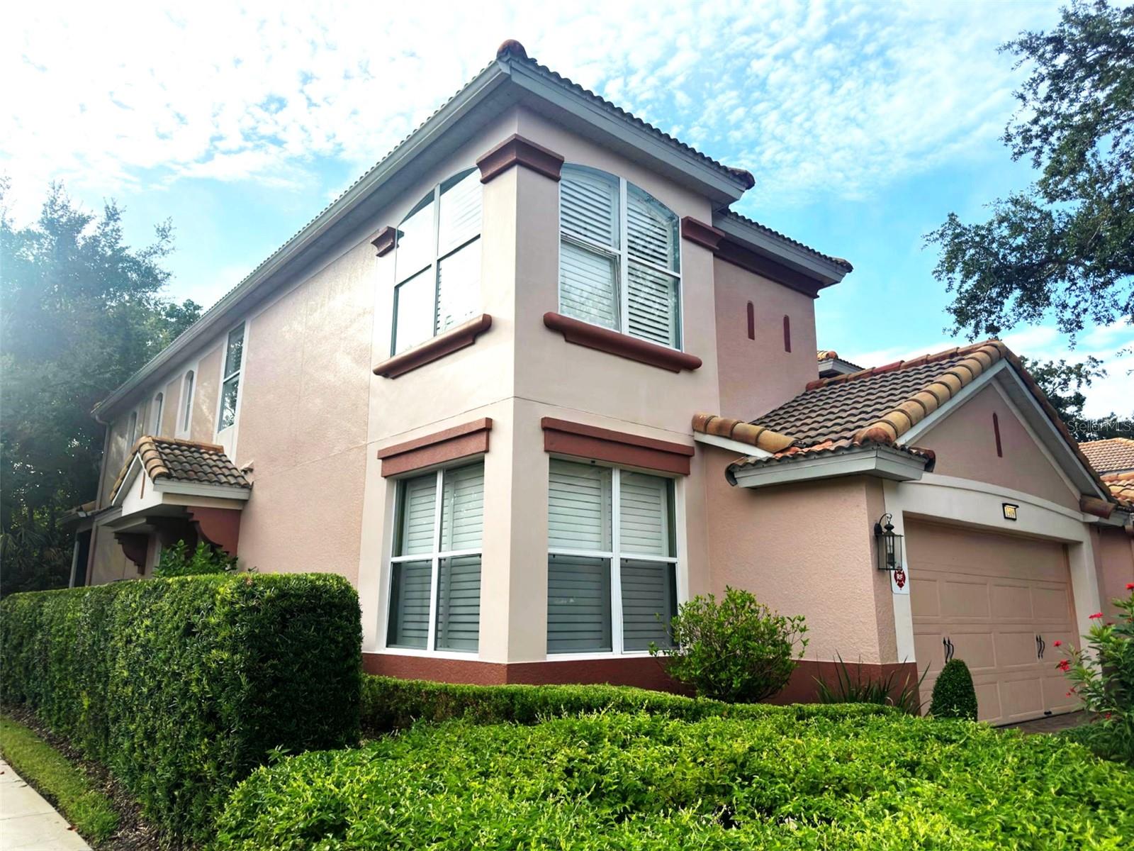 Looking for the perfect retreat in an awesome gated community? You just found it!!! This beautiful 2,400+ square foot home is located in Champions Gate. It is close to the attractions, shopping with easy access to I-4, 429, 417 and the Turnpike. The home has a large Family room/Dining room combination with a 2 story ceiling the gives a spacious feeling to area. The Kitchen has Granite counters with Cherry cabinets, a generous Island, a separate Breakfast eating area and very large Pantry. The floors in the living areas and first floor Primary Bedroom are beautiful Cherry and there is tile in the wet areas. Upstairs are the additional Bedrooms, a Loft and an Office or study area. Outside, you can relax on the screened Patio that overlooks a wooded area. This is a Great Home, waiting for a new owner. Let that be you!!!!