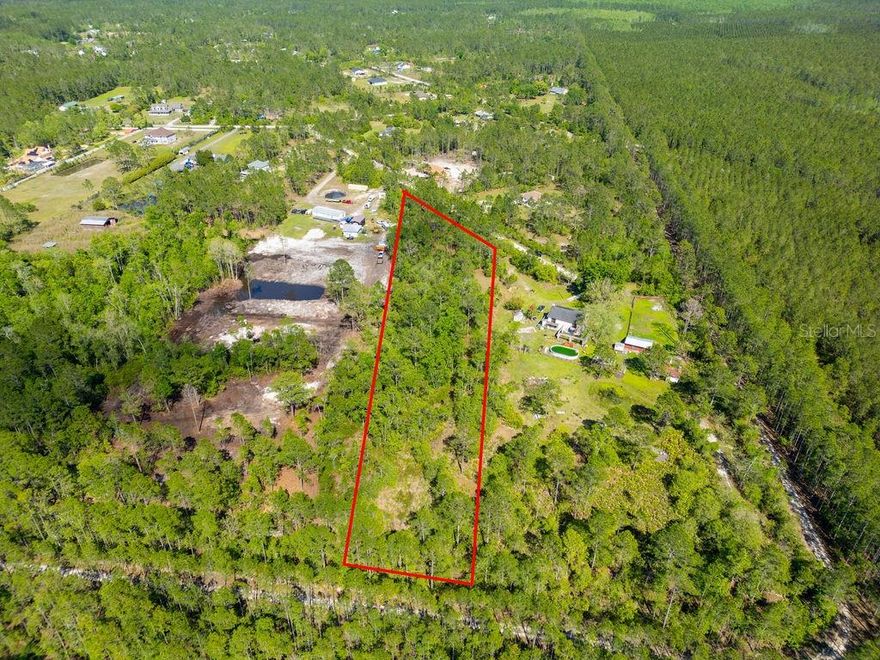 Discover the perfect opportunity to build your dream home in the peaceful Plantation Pines community of Ormond Beach. Nestled on an expansive 3.46-acre parcel, this property offers the ideal blend of privacy and convenience. Tucked away on a quiet dead-end street and surrounded by mature trees and natural Florida beauty, this serene setting creates the perfect backdrop for your custom estate. With ample space to design your ideal lifestyle, there’s plenty of room for a custom home, pool, guest house, workshop, and more. Whether you’re looking for a private retreat or a place to bring all your toys, this oversized lot accommodates boats, RVs, and recreational vehicles with ease—and best of all, HOA is optional. Enjoy the tranquility of country living while being just a short drive to the beach, shopping, dining, schools, and easy access to I-95.